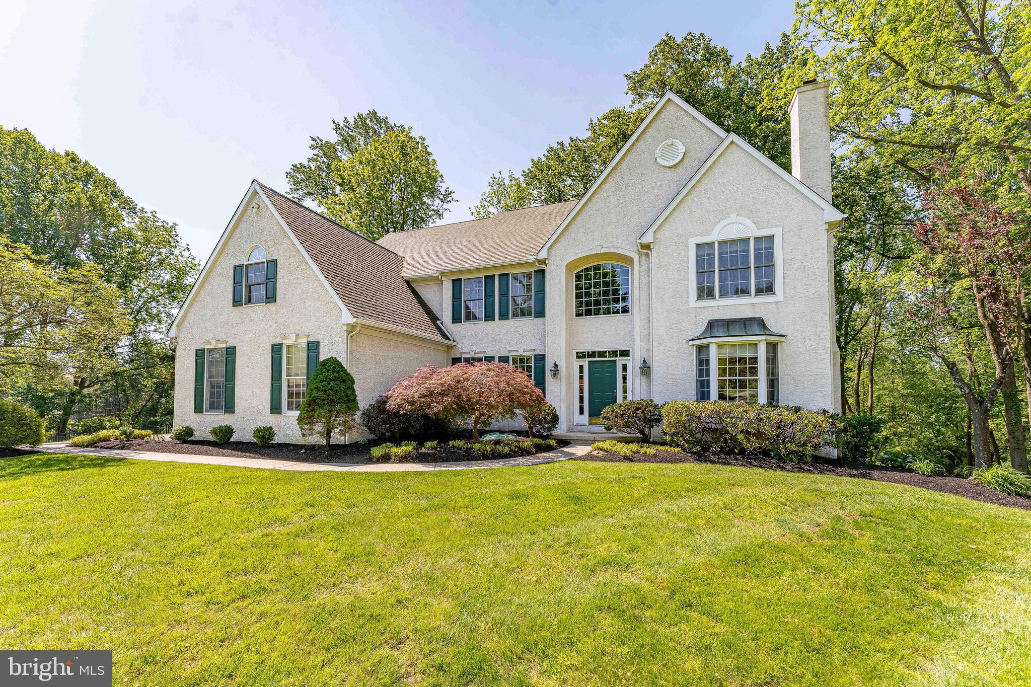 Welcome to 936 Kilduff Circle, a 4-bedroom, 3.5-bath single-family home in West Chester. Set on just over an acre in a private cul-de-sac, this home offers a peaceful setting with a secluded backyard that backs to the woods for added privacy and natural views. As you approach, a spacious six-car driveway and three-car garage provide ample parking and convenience. Inside, the two-story foyer features hardwood flooring and a split staircase that creates a grand first impression. To the right of the foyer, the living room offers carpet flooring, crown molding, and a wood-burning fireplace, creating a comfortable space to relax. A conveniently located powder room and private home office are also situated on this side of the home. To the left of the foyer, the dining room features hardwood flooring, crown molding, and chair rail with wainscoting, making it an ideal space for entertaining. The adjoining family room includes hardwood floors, semi-vaulted ceilings, and a dramatic floor-to-ceiling stone wood-burning fireplace. The kitchen is equipped with an island with seating, a double sink, pantry storage, and hardwood flooring. Just beyond, the breakfast area features a sliding door leading to the deck, creating an easy indoor-outdoor flow. A mudroom and laundry area complete the main level. Upstairs, the spacious primary suite includes carpet flooring, a vaulted ceiling, ceiling fan, and two walk-in closets. A separate sitting room with glass French doors provides additional flexibility, while a bonus room with track lighting is perfect for a nursery, second office, personal gym, or private retreat. The en-suite bathroom features tile flooring, a vaulted ceiling, a step-in shower, jetted tub, and double sink vanity. Three additional bedrooms, all with carpet flooring, offer comfortable space for family or guests. The second and third bedrooms share a Jack-and-Jill bathroom with double sink vanities and a tub and shower combination. The fourth bedroom includes its own en-suite bathroom with tile flooring and a tub and shower combination. The walk-out lower level offers southern facing windows with incredible potential including 9-foot ceilings, rough plumbing already in place, and ample space to create additional living, entertaining, or guest areas. Conveniently located near local shopping, grocery stores, restaurants, Bayard Rustin High School, and just a short drive to downtown West Chester, this home offers both privacy and accessibility. Don’t miss the opportunity to make 936 Kilduff Circle your new home.