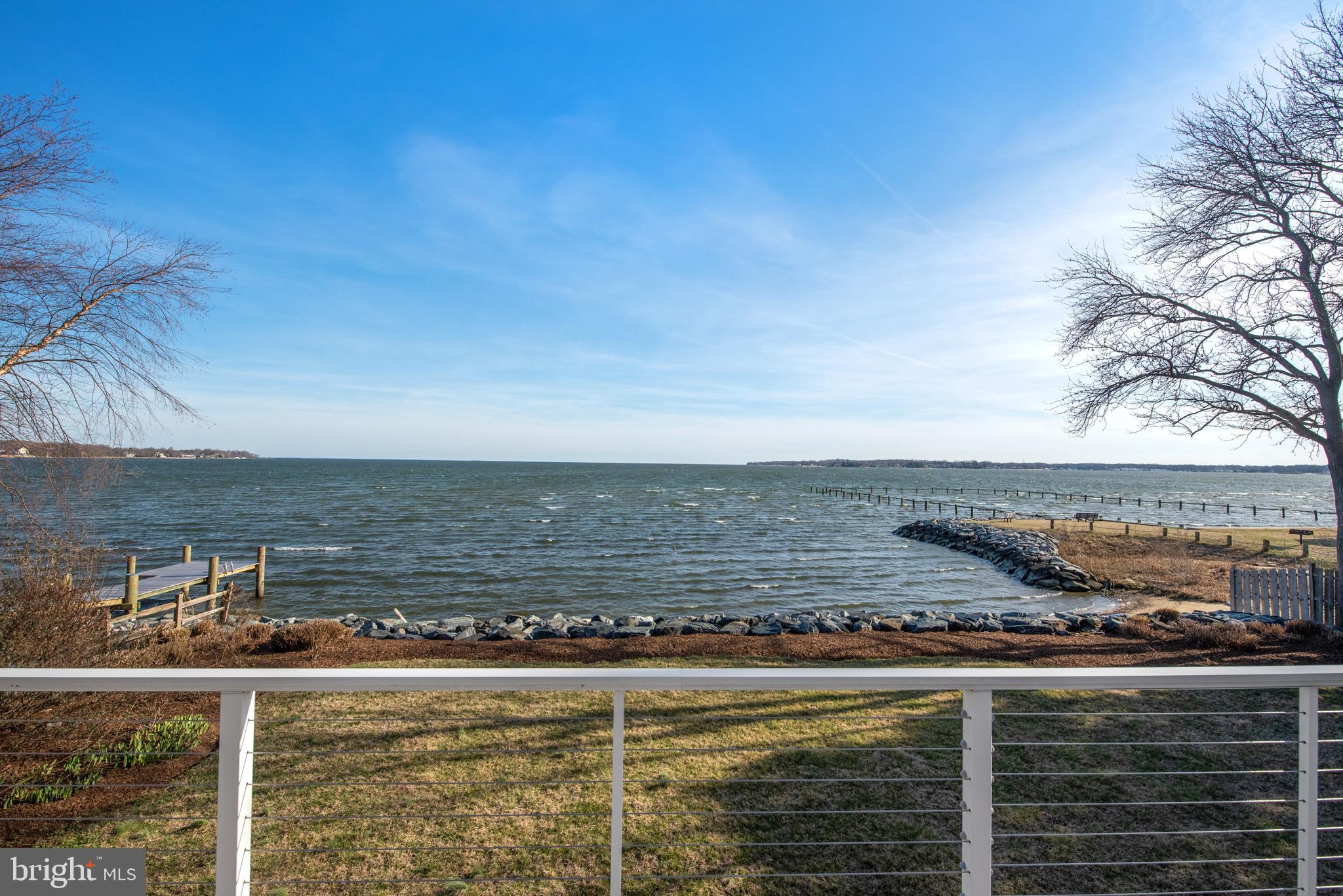 One of the best views on the South River. Contemporary split foyer, riparian waterfront home with spacious Brazilian Hardwood deck faces South with views of sunrise and sunsets. Contemporary with open floor plan and spacious  kitchen,  great room and family room with wood burning fireplace and primary suite with views of the South River. Lower level has 3 additional bedrooms, a recreation room with gas  fireplace that opens to the waterside patio, double garage. Recent roof and extra wide gutters and HVAC. Whole house  generator. Baths and kitchen in need of updating. No pier on property.
