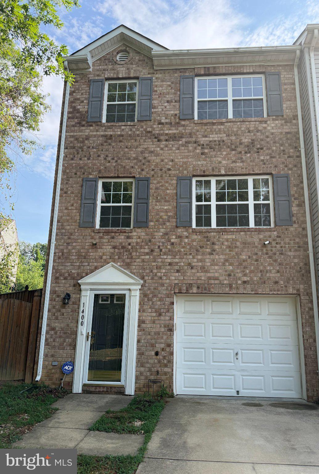 Welcome to 1400 Estelle Drive, Oxon Hill, MD—where space, style, and convenience come together! This well-maintained end-unit townhome offers 3 bedrooms, 2 full bathrooms, 2 half bathrooms, and approximately 1,875 square feet of comfortable living space designed to fit today's lifestyle.

Step inside to the main living level, where you'll find hardwood flooring (and stairs) throughout (with the exception of the kitchen),  creating a warm and inviting atmosphere. The spacious living room features a gas fireplace, making it the perfect place to relax or entertain. The kitchen is appointed with quartz countertops, ample cabinetry, and direct access to a private deck—ideal for morning coffee or evening gatherings. Stairs lead from the deck to the lower-level patio and fully fenced backyard, providing a wonderful space for outdoor entertaining, gardening, pets, or play. The finished lower level offers flexible living space that can easily serve as a recreation room, home office, fitness area, or media room, along with a convenient half bath and direct access to the one-car garage. Parking is plentiful with a one-car garage, attached driveway, and two reserved parking spaces.

Recent updates include a new hot water heater and an HVAC capacitor replacement (June 2026), offering added peace of mind. The home is also equipped with leased solar panels, providing energy efficiency and utility savings. Residents enjoy community amenities including a swimming pool and tot lot, all within an HOA-managed neighborhood. Conveniently located just minutes from National Harbor, MGM National Harbor, Tanger Outlets, major commuter routes, Washington, D.C., and Northern Virginia, this home offers the perfect blend of comfort, convenience, and accessibility. Don't miss your opportunity to own this exceptional end-unit townhome in one of Oxon Hill's desirable communities. Schedule your private tour today and discover all that 1400 Estelle Drive has to offer!