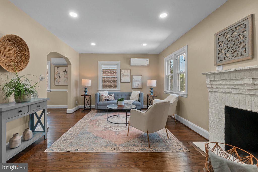Completely renovated from top to bottom, 3027 Lavender Ave is the definition of move-in ready. This stunning brick Colonial has been thoughtfully updated throughout with brand-new systems, stylish finishes, and modern conveniences while still maintaining its timeless charm and character. Nearly every inch of the home has been refreshed, allowing the next owner to simply unpack and enjoy. Major renovations include all new windows, updated electric (inspected and permitted), a brand-new hot water heater, and completely updated HVAC systems featuring ductless mini splits on the main level and basement, plus a separate system serving the upper level for efficient comfort throughout the home. Fresh paint brightens every room, restored original hardwood flooring adds warmth and elegance, and new carpet has been installed in the fully finished basement. Waterproofing improvements have also been completed, offering added peace of mind for years to come. Situated on a spacious corner lot in Parkville, this property offers front, side, and rear yard space, a detached 1-car garage, private driveway parking, and plenty of additional street parking for guests. The classic brick exterior delivers timeless curb appeal while the completely renovated interior offers the modern open-concept living buyers are searching for. Inside, the welcoming living room features a cozy wood-burning fireplace and flows seamlessly into the dining area and beautifully redesigned kitchen. The kitchen is truly the heart of the home, showcasing sparkling quartz countertops, crisp white cabinetry, brand-new appliances, and a large center island perfect for entertaining, meal prep, or casual dining. The open floorplan creates an airy and connected feel ideal for both everyday living and hosting gatherings. The upper level includes three comfortable bedrooms and a full bathroom, while the fully finished basement provides valuable additional living space complete with a second full bathroom, abundant closet and storage space, and direct garage access. Whether used as a family room, guest area, home office, or recreation space, the basement offers flexibility to fit a variety of lifestyles. Every detail of this home has already been completed for you. With extensive renovations, modern upgrades, and classic Colonial charm, 3027 Lavender Ave offers the rare opportunity to own a truly turnkey home in a convenient Parkville location close to shopping, dining, parks, and commuter routes.