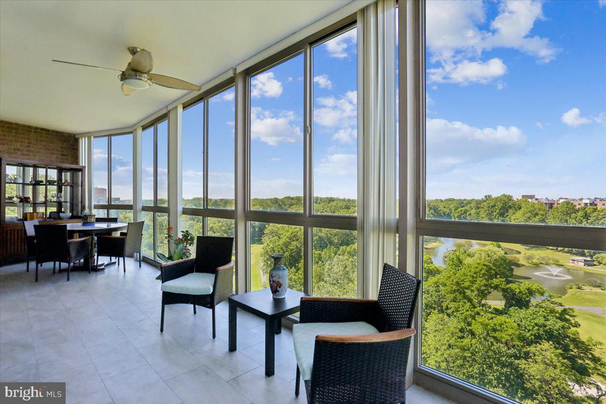 COMPETITIVE NEW PRICE!!!

Views for miles from this rarely available penthouse-level 2 BR 2 BA plus den unit with garage parking in amenity-rich Leisure World,  a 55+ senior living community with on-site restaurants, clubhouses, health care, athletic amenities including two golf courses, pickleball, ping pong, tennis, and so much more. Perched on the top floor, this condo is one of the largest models and showcases panoramic, unobstructed views of lush greenery, walking trails, and golf courses from the stunning enclosed sunroom balcony that spans the length of the home — the perfect backdrop for relaxing afternoons or effortless entertaining in every season. 
The beautifully appointed kitchen features abundant cabinets, storage, space for a table, breakfast bar, and more. Beyond, an open and airy layout with dining area and living space and additional den in a prime spot to overlook the extensive grounds and vistas of Leisure World. The owner's suite features walk in closet plus bonus closet, soaring ceilings, and ensuite bathroom with renovated shower and second walk-in shower. Both bedrooms walk out to the fabulous enclosed sunroom balcony with horizon views. Second bathroom in hallway convenient to second bedroom and open living space. SO many upgrades inside including new LG Refrigerator (2025), renovation to primary bath and addition of second shower, new flooring throughout and new paint (2024), and newer HVAC. All of this in the heart of the best Leisure World has to offer, steps from miles of walking trails, indoor and outdoor pools, community spaces, and so much more only minutes from Silver Spring, downtown Rockville, 270/495, and Washington DC. Your Leisure World penthouse suite awaits!