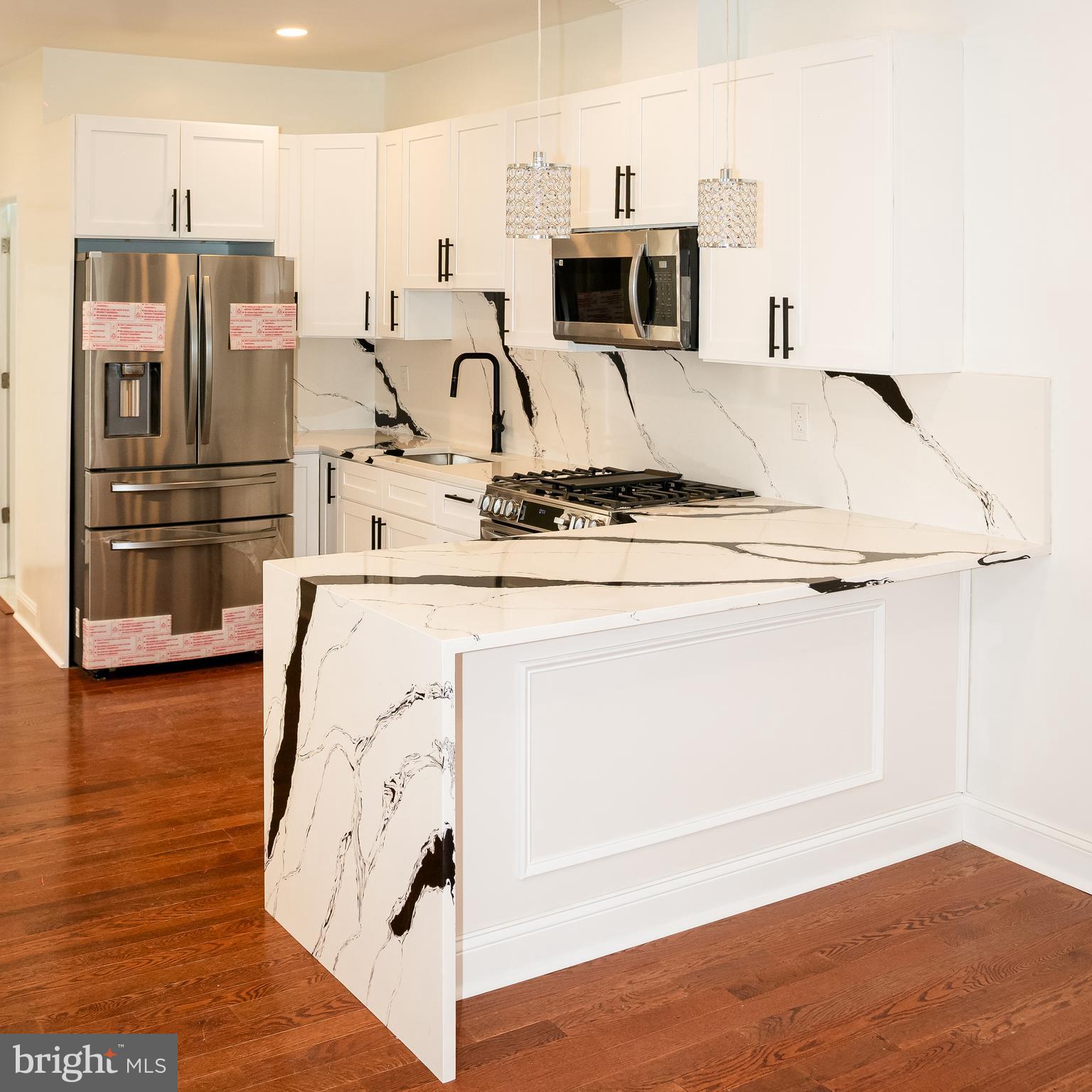 Beautifully renovated 4-bedroom, 3.5-bath move-in-ready home in the heart of Cobbs Creek. Thoughtfully redesigned with elevated finishes throughout, this stunning residence offers a bright open-concept layout, a sleek modern kitchen featuring stylish cabinetry, stainless steel appliances, and a clean contemporary aesthetic.

The inviting main living area is anchored by a newly built fireplace, creating the perfect focal point for everyday living and entertaining. Upstairs, the spacious primary suite offers a private en-suite bath and its own fireplace, delivering a rare blend of comfort, character, and luxury. Generously sized bedrooms and a fully finished lower level provide flexible living space ideal for a media room, home office, gym, or guest accommodations.

Step outside to a private rear patio, perfect for summer barbecues, outdoor dining, family gatherings, or simply relaxing after a long day.

Conveniently located near public transportation, shopping, parks, and major commuter routes, this home offers the perfect combination of style, functionality, and accessibility. Nothing to do but move in and enjoy. Schedule your private showing today.