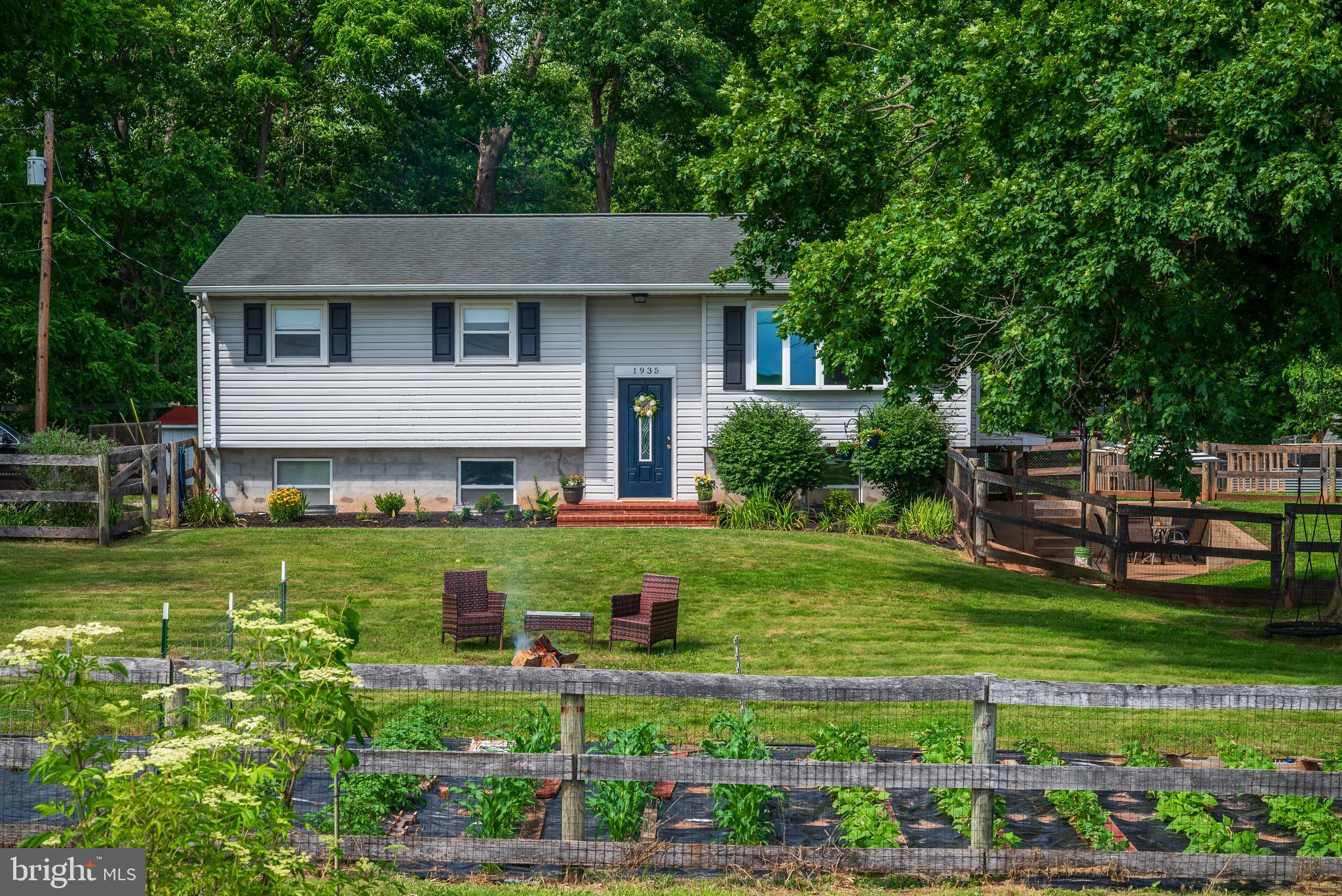 Private back yard backs up to Big Pipe Creek.   View out the front door overlooks spacious farm land.  Make this property your new  home! Beautiful wood floors throughout the home. It is a 3 bedroom home with 2 full baths. Cozy family room and deck leading out to the back yard. Both the front yard and back yard are fenced in which make it the perfect environment for gathering with friends, playing sports,  gardening or any other outdoor hobbies.  Has great views from both the front porch overlooking scenic farmland & the back deck overlooking peaceful woods.  Come and see all that  this charming home has to offer. This could just be your next forever home.