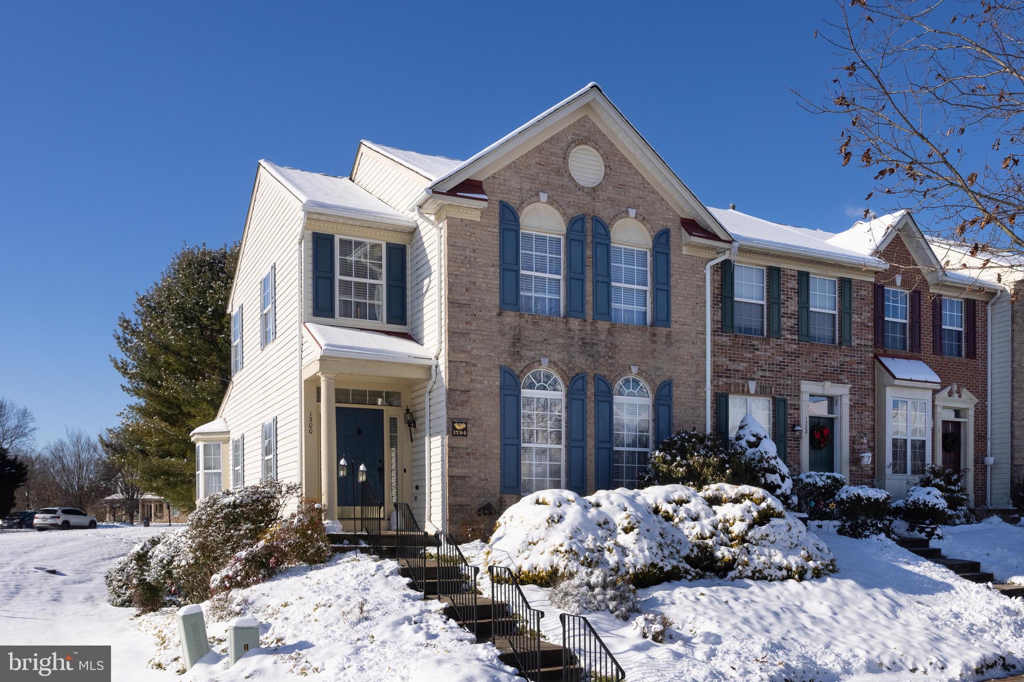 Welcome to this stunning 4-bedroom, 4.5-bathroom end-of-group brick front townhome nestled in the desirable Hickory Overlook neighborhood. This meticulously maintained home boasts a range of features that make it a true gem. Hardwood flooring flows seamlessly throughout the main and upper levels, complemented by crown and chair railings, creating an elegant ambiance. The heart of the home is the upgraded kitchen with granite countertops, ample space, and top-of-the-line appliances. The GE electric range, featuring a "hot air" fryer and synchronized burners for a double griddle, is a highlight. The open plan living and dining rooms provide a perfect setting for entertaining, enhanced by the abundance of natural light from side windows. Two primary bedrooms, each with its own upgraded bathroom, offer comfort and luxury. The first-floor primary bedroom features 2 closets, a soaking tub, and a double marble vanity. The second primary bedroom on the upper level includes a well-appointed bathroom with a combo tub and shower. Bedrooms 3 and 4 share the third full bathroom on the upper level. The convenience of ceiling fans in all bedrooms ensures year-round comfort. The attic, accessible via pull-down stairs, is well-insulated and features flooring and a local TV antenna. The walkout level family room is a cozy retreat with a gas fireplace and views of the lawn and garden. An additional full bathroom with a walk-in shower adds functionality. The rec room with kitchenette, equipped with a double sink,  white cabinetry and new additional refrigerator, is complemented with built-in cabinets, and ample storage. Outdoor living is enhanced by a 20 x 12 Trex deck off the dining room, complete with a new electric grill. The brick patio below includes a shed and trunk for additional storage. The property also offers two designated parking spaces and plenty of street parking. With its impeccable condition, thoughtful design, and desirable neighborhood, this townhome provides a perfect blend of style and functionality.