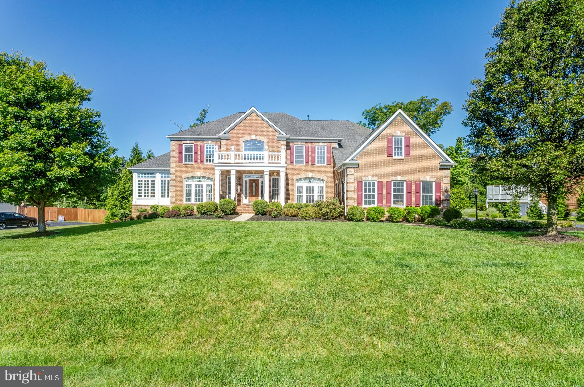 Nestled in the beautiful neighborhood of Occoquan Overlook in Lorton, this exquisite single-family home boasts three meticulously finished levels, offering both luxury and comfort. 

Previously serving as a model home, this property exudes a standard of excellence and attention to detail that is evident in every corner. From the thoughtful layout to the great detailed finishes, this home is a testament to quality craftsmanship and design. It stands as a proud representation of what life in Occoquan Overlook can offer – a blend of elegance, comfort, and a touch of luxury, all very welcoming. Whether you're entertaining guests, enjoying family time, or seeking a peaceful retreat, this home caters to every need with grace and style.

The home welcomes you with a grand foyer featuring double staircases that have everyone in awe. The heart of the home is the double-story family room, where natural light floods in through expansive windows, enhancing the sense of space and grandeur. The plush new carpet adds a touch of elegance and comfort underfoot.  One can have a luxurious office along with the library/sunroom  which provides a tranquil retreat, ideal for enjoying morning coffee or basking in the afternoon sun. The home's versatility is further showcased by the enormous laundry room, which can serve as a crafting paradise or a hub for a side business, thanks to its generous size and layout. And, it offers a separate entrance.  

The kitchen, expanded with the sunroom, offers a harmonious blend of form and function. It's a culinary artist's dream, with top-of-the-line appliances, abundant counter space, and a layout that invites social cooking experiences. This space seamlessly integrates with the breakfast room and the sunroom, making it perfect for entertaining or enjoying casual family meals in a sunlit ambiance.  

The sleeping quarters comprise 4 well-appointed bedrooms, each a sanctuary of peace and privacy. The four bathrooms on this level, including a luxurious master suite, are designed with sophistication and functionality in mind. The master suite itself offers ample space including a spacious sitting room and a huge walk-in closet. This entire level features new gleaming hardwood floors throughout. 

The walk-out basement reveals a fully equipped in-law suite, perfect for guests or extended family stays. As you ascend to the bedroom level, the gleaming new hardwood floors catch the light, creating a warm and inviting atmosphere. 

Entertainment is at the forefront of this home's design, with a dedicated home theater where you can immerse yourself in cinematic experiences without leaving the comfort of your abode. The entertainment room is another space where fun and relaxation meet, perfect for hosting game nights or unwinding with loved ones.