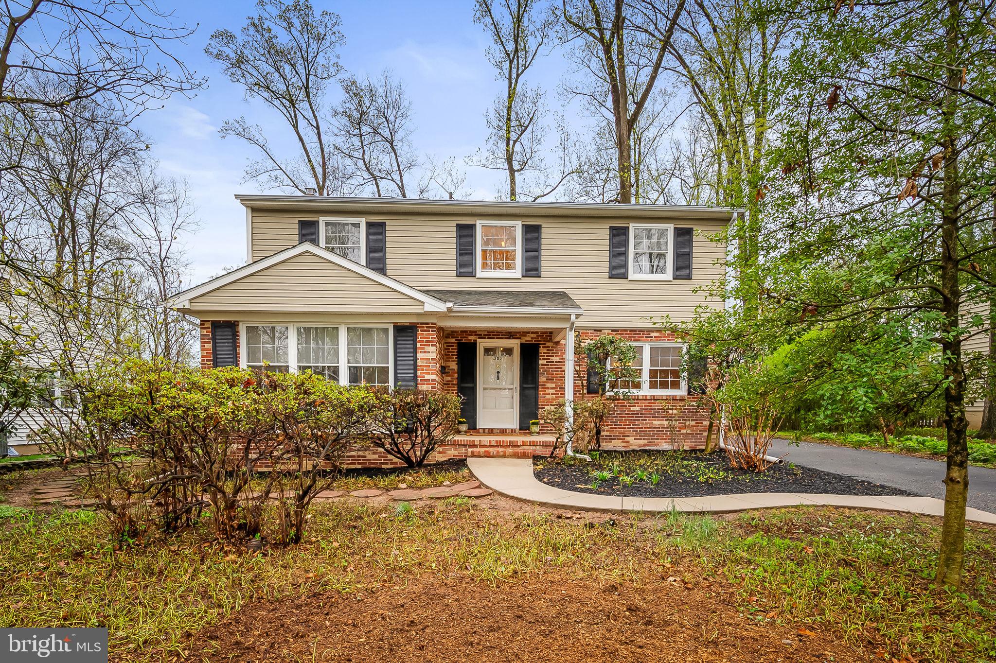 Welcome to this charming, sun-filled traditional home in the highly sought-after Valley Wood neighborhood! Brimming with potential and ready for your personal touches, this 4-bedroom, 2.5-bath gem offers a fantastic layout and solid craftsmanship. Hardwood floors lie beneath the carpet, just waiting to be revealed. The first floor features a spacious living room, a separate dining room perfect for gatherings, and a cozy family room with a wood-burning fireplace and bookshelves. The eat-in kitchen provides a great space to create and connect. Upstairs, the primary bedroom includes an en suite bath, while three additional bedrooms and a hall bath complete the level.  The lower level offers a generous crawlspace for storage and endless possibilities for customization. Outside, a quaint front porch adds curb appeal, while the tree-filled backyard offers privacy and a natural setting, just waiting for your vision. Located just around the corner from Pinewood Elementary. HVAC (2020), HUMIDIFIER  (2024). The community association is voluntary, with an annual fee of approximately $30.00/year.