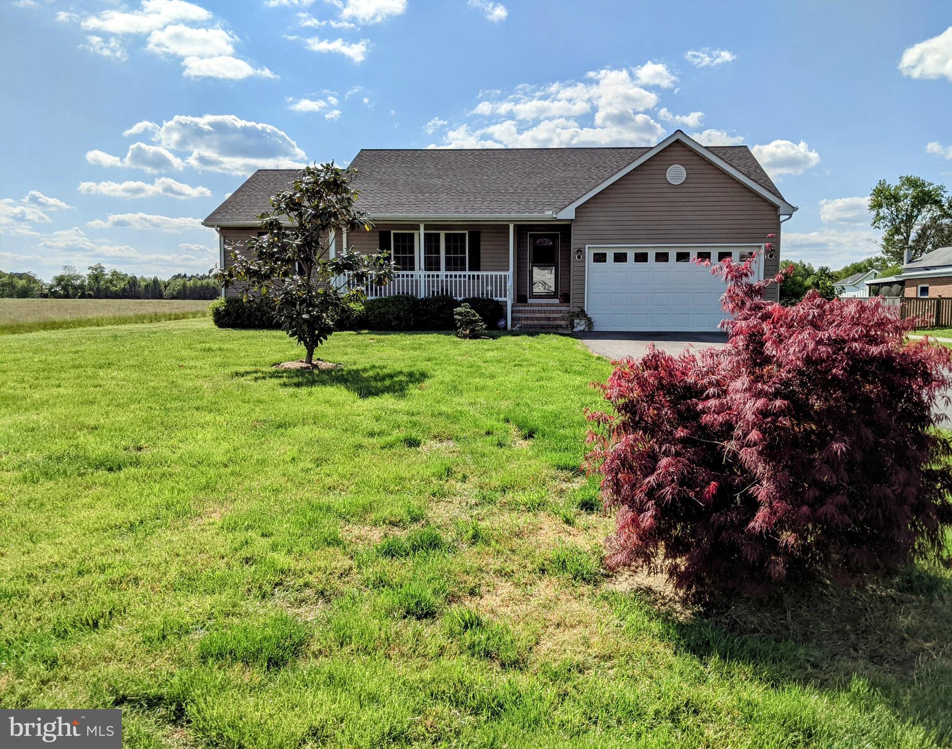 Beautifully maintained very sought-after ranch style home featuring 3 bedrooms, 2 baths and 2-car garage sited on 1/2 acre.  Cozy front porch to gaze at the country fields and rear deck is perfect for entertaining.  Public boat ramp across the street is perfect for a boat ride to the Narrows for dinner and sunset!  Close to shopping, churches, and restaurants.