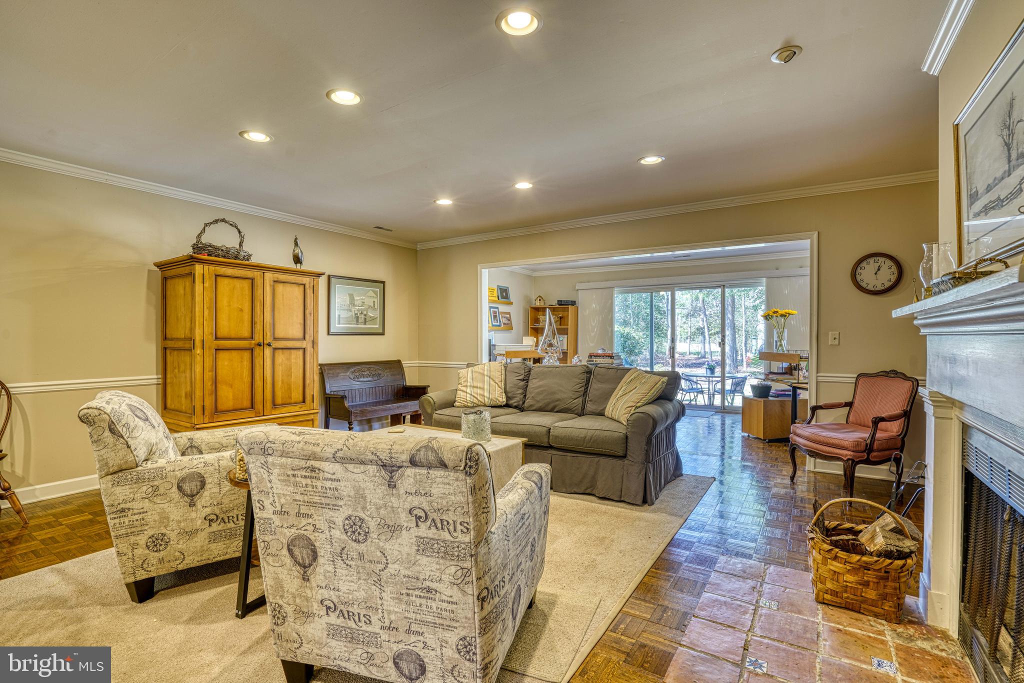 Widgeon Place is a charming townhome enclave within the desirable Martingham community, offering effortless comfort and nearly maintenance-free living. Just minutes from the historic waterfront town of St. Michaels, this home is ideally suited for year-round living, a relaxing weekend retreat, or a smart investment opportunity.  Martingham overlooks the renowned Links at Perry Cabin Golf Course—originally designed by Pete Dye Sr. and thoughtfully reimagined by Pete Dye Jr.—providing a picturesque and prestigious setting and  this location is one of the few buildings overlooking the golf course.  Inside the residence features hardwood floors throughout the entry, living, dining, and sunroom areas and ceramic tile in the entry, half-bath and kitchen.  The upper level offers two en-suite bedrooms, including a spacious primary suite with a private deck.  A rear patio extends from the sunroom, creating additional outdoor living space, and a convenient half bath is located on the main level. Each unit also includes a one-car garage with additional storage space for the homeowner. 
With its serene setting overlooking a pond on the golf course, this is a great opportunity for those looking to enjoy the best of St. Michaels.