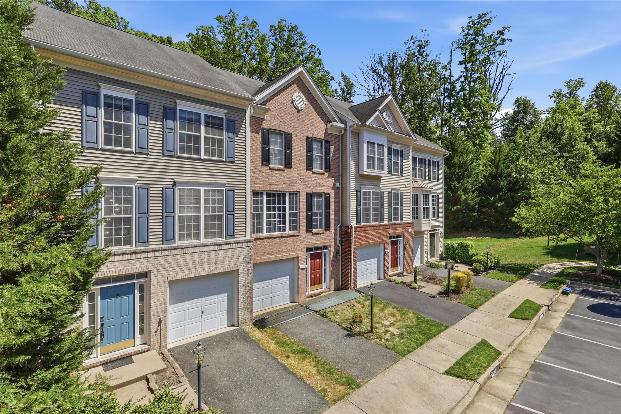 PRICE IMPROVEMENT!! Don't miss your chance to own this delightful end-of-row townhouse located in the charming Azalea Woods community. Looking for move-in ready, comfort and convenience? Here it is! Built in 2004, this Colonial-style end-unit townhome features a well-maintained interior, showcasing three spacious bedrooms and two full bathrooms, along with a convenient half bath on each of the lower levels. The traditional floor plan seamlessly connects the living and dining areas, creating an inviting atmosphere for gatherings. The kitchen is equipped with a gas oven/range, built-in microwave, and dishwasher. Every window looks out at nature, with both a front view of community maintained green space and serene views of the surrounding trees and woods to the back. The backyard is fully fenced with access directly from the main floor. The fully finished basement provides additional living space, perfect for a home office or play area, while the attached garage and driveway, with additional designated parking space offer ample parking. The community benefits from common area maintenance, snow removal, and trash services. Located in a suburban setting, this home is just a short drive from commuter lots, making it ideal for those who travel. The neighborhood is known for its friendly atmosphere, with nearby parks and recreational areas perfect for outdoor activities. Local schools are highly regarded, providing excellent educational opportunities.