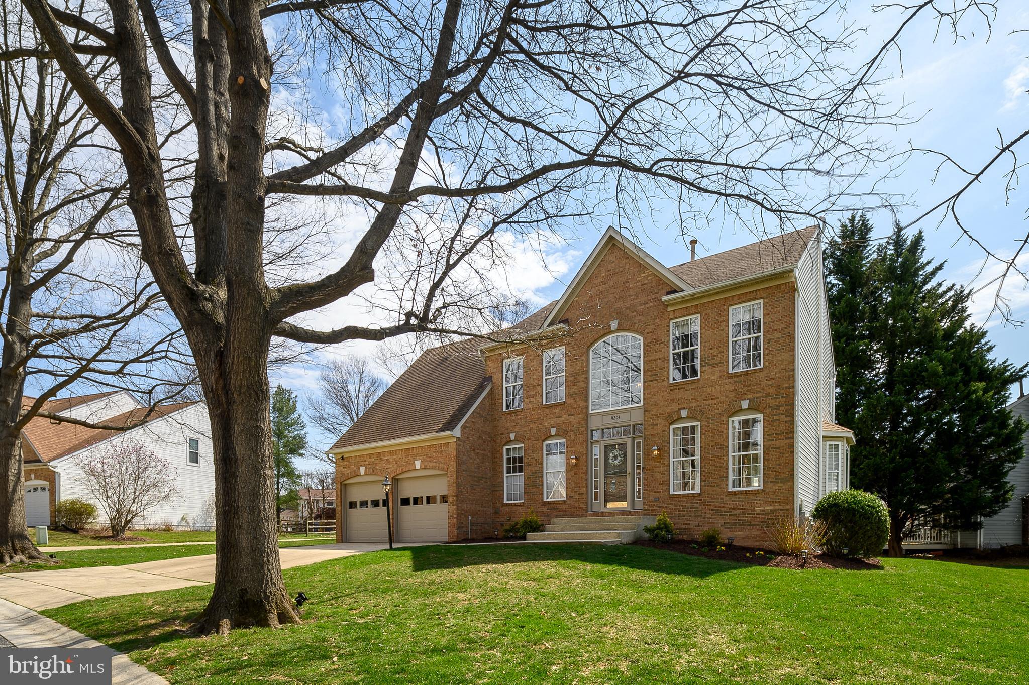 Welcome to 9204 Adalee Ct, a charming home nestled in a tranquil cul-de-sac just steps away from the scenic Lake Elkhorn Park in Columbia, Maryland. This inviting residence features beautiful wood flooring throughout the main level, complemented by pleasing paint tones and abundant natural light streaming through the living and dining rooms. The kitchen is both modern and elegant, boasting pristine white cabinetry, newer granite countertops, stainless steel appliances, and an attractive white stone backsplash. Adjacent is a cozy family room warmed by a fireplace, with direct access to a delightful screened-in patio perfect for enjoying peaceful evenings. Conveniently located on the main level is a spacious laundry room that leads directly to the attached two-car garage. The upper level offers four generously sized bedrooms, including a primary suite complete with an updated ensuite bathroom featuring dual sinks and a spacious walk-in shower with a corner seat. The lower level recreational area includes a charming small bar, ideal for entertaining, along with ample storage space. Living in Columbia, you'll enjoy easy access to walking paths, parks, shopping centers, restaurants, and the vibrant community lifestyle that makes this area consistently ranked as one of America's best places to live.