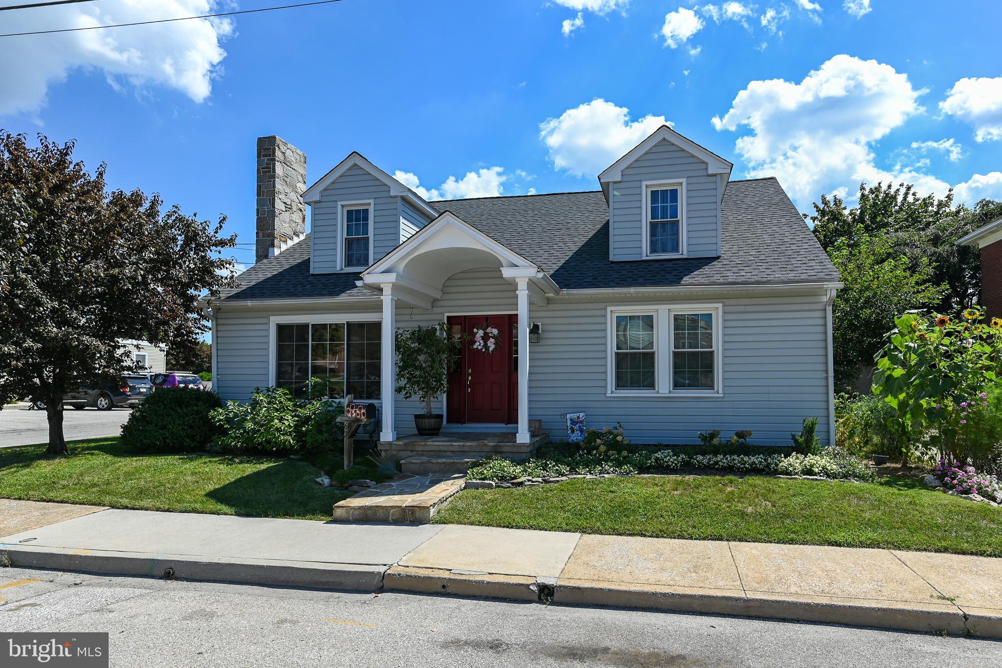 Charming 4 bedroom Cape Cod with over 2200 square feet.  Well cared for home with beautiful original woodwork.  Large living room with a built in book case and a butler stone fireplace with woodstove insert.  Dining room with french door exits to a side covered porch.  Kitchen was redone with newer cabinets, tile backsplash, LVT flooring and pantry.  2 bedrooms on the 1st floor and the bath has an antique dresser vanity.  Upstairs boasts 2 bedrooms, a bath and a hall cedar closet.  Full basement offers plenty of storage.  Exit the kitchen door to a shaded back yard fully landscaped!  Many perennials and a gorgeous magnolia tree.  Single car garage at the rear of the lot.  New roof in May 2022.  Call today to see this great property!