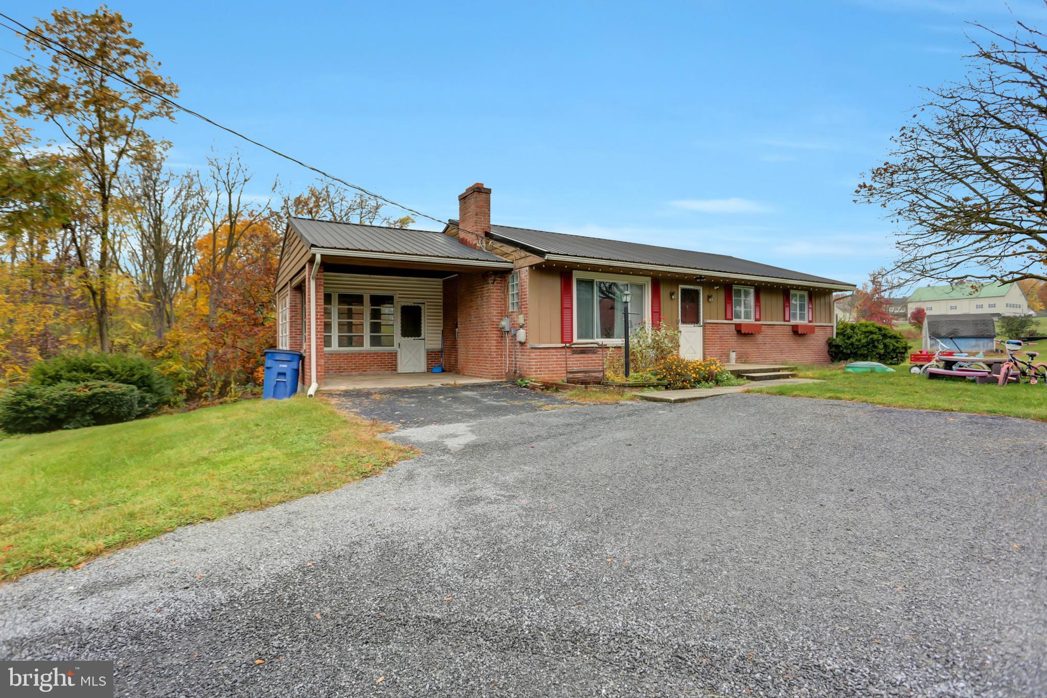 Enjoy this Raised Rancher with walk out basement. Basement has a large room that is finished, the other side is an unfinished storage room. This home is located at the end of a small development. Home backs up to fields. Conveniently located to the Main Highway, Lincoln Way West. The living room has a woodburning fireplace. Kitchen has Granite countertop. Hardwood floors have just been sanded and refinished.