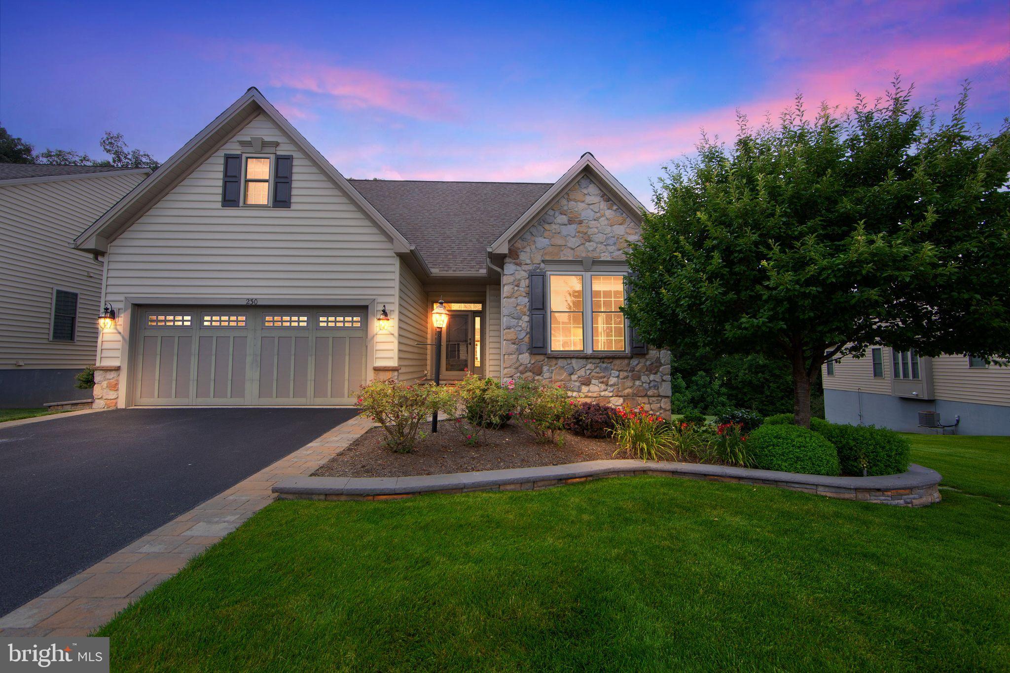 This is the best VALUE for the combination of the most desirable lot, large square footage, and location in the community! Prepare yourself to be impressed! This home shows like a model and the private lot can not be beat! Totally refreshed with thoughtful upgrades and exquisite details, if you're seeking to move to a 55+ community without sacrificing the features and space of a single-family residence, look no further. The size of this home is generous including areas for family gatherings, guest accommodations, a home office, entertainment and hobbies. Enjoy spectacular views , space between neighboring homes and expansive outdoor spaces designed for relaxation and socializing.

Only an out-of-state move has made this pristine, like-new property available. As you arrive, you'll notice the evident pride of ownership in this meticulously cared-for home. Enter through the gracious foyer, where fresh paint, gleaming hardwood floors, custom window treatments, abundant recessed lighting, and elegant oiled bronze hardware welcome you.

At the heart of the home lies a grand,  modern open area, featuring a spacious kitchen with handsome, creamy cabinetry, exquisite quartz countertops, stainless steel appliances, a generously sized pantry, and an expansive center island, complemented by an inviting dining area, complete with a cozy gas fireplace and custom built-ins. This space seamlessly flows into the expansive Family Room area which expands out to a low-maintenance TimberTech deck with stylish black railings, overlooking serene trees and providing access to the private backyard.

Arched doorways add character as you proceed to the elegant first-floor primary suite. The primary bedroom features a beautiful tray ceiling with uplighting and a ceiling fan, a transom window, and a custom Closets By Design walk-in closet. The primary bathroom is spacious and bright, with an oversized shower, soaking tub, updated vanity and extra cabinetry. Another main floor room, enclosed by glass French doors, serves as a quiet home office or additional bedroom, accompanied by a full guest bathroom. A convenient laundry room and immaculate two-car garage complete the main floor.

Upstairs, you'll find a large open loft area, complete with its own bedroom, full bathroom, and a stupendous custom closet. This level is ideal for a live-in relative, guests, or as a separate area for quiet activities, reading, crafts, or an additional home office.

The lower level is a true showstopper, offering expansive space for entertainment and recreation. Handsome wood flooring leads you to a custom wet bar with a sink, wine and beverage fridges, custom cabinetry, and shelving. This area also features another gas fireplace, custom built-ins, and plenty of room to watch the big game or movies and enjoy family time. A separate room can be used as a guest bedroom, hobby room, or additional home office. There is another great full bath and two generously sized storage rooms completing the lower level. Step outside to the charming rear paver patio with a pergola, perfect for savoring the serene backyard views and sounds.

This home was constructed with upgraded landscaping and hardscaping, gutter guards, an enhanced exterior lighting package, sprinkler system, alarm system, and water softener, leaving no detail overlooked.

Located in the desirable Honeycroft Village community, residents enjoy access to a pool area, fitness center, bocce ball, horseshoes, a fire pit and community garden. With lawn care, snow removal, and trash services taken care of, you can move in and start enjoying life. Nearby, you'll find restaurants, farmers' markets, golf courses and shopping. Schedule your private tour today! Homestead exclusion could be applied for tax savings.