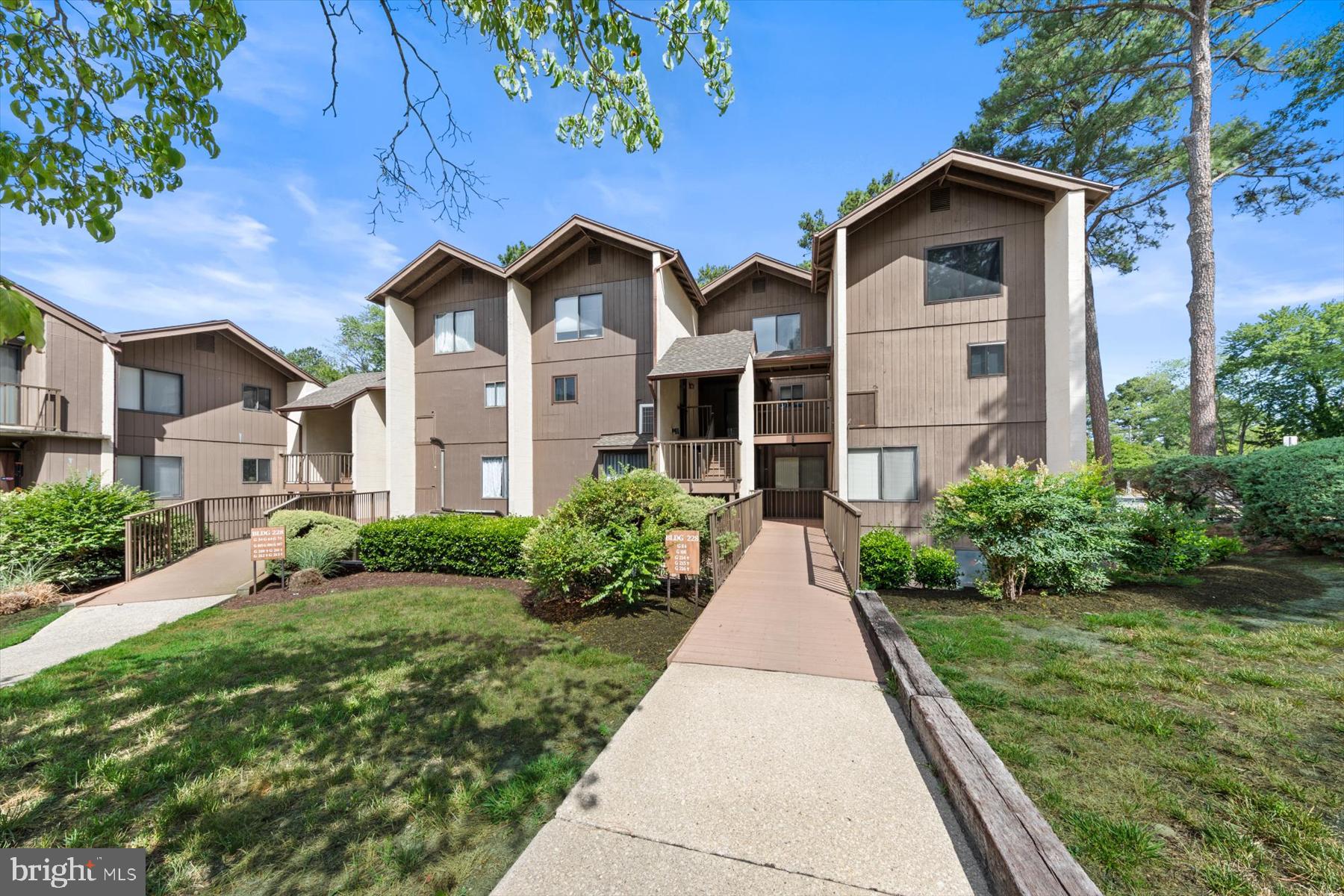 Welcome to this well‑maintained 2‑bed, 2.5‑bath, two‑level condo in the Canal Woods Condo Community on the southeast side of Wicomico County. Located within Salisbury city limits, this property offers a convenient location while still tucked away in a quiet, private setting.   Salisbury University is less than 1 mile north.  Tidal Health Hospital is less than 2 miles north and Walmart is less than 1 mile south.  The first level includes a kitchen with granite countertops, stainless‑steel appliances, updated modern-style cabinetry, and ceramic tile flooring, along with a dining area, living room, and an half bath. The foyer and living area showcase beautiful, low‑maintenance bamboo flooring.   Sliding doors off the living room open to the balcony—a great space for morning coffee or unwinding after a long day.
The second level includes the primary bedroom which has its own private full bath, and Bedroom 2 which is just down the hall. Both bedrooms and the hallway feature the same beautiful bamboo flooring.  The two upstairs bathrooms have been updated with upgraded finishes.  Conveniently located on the second level is the laundry/utility area.