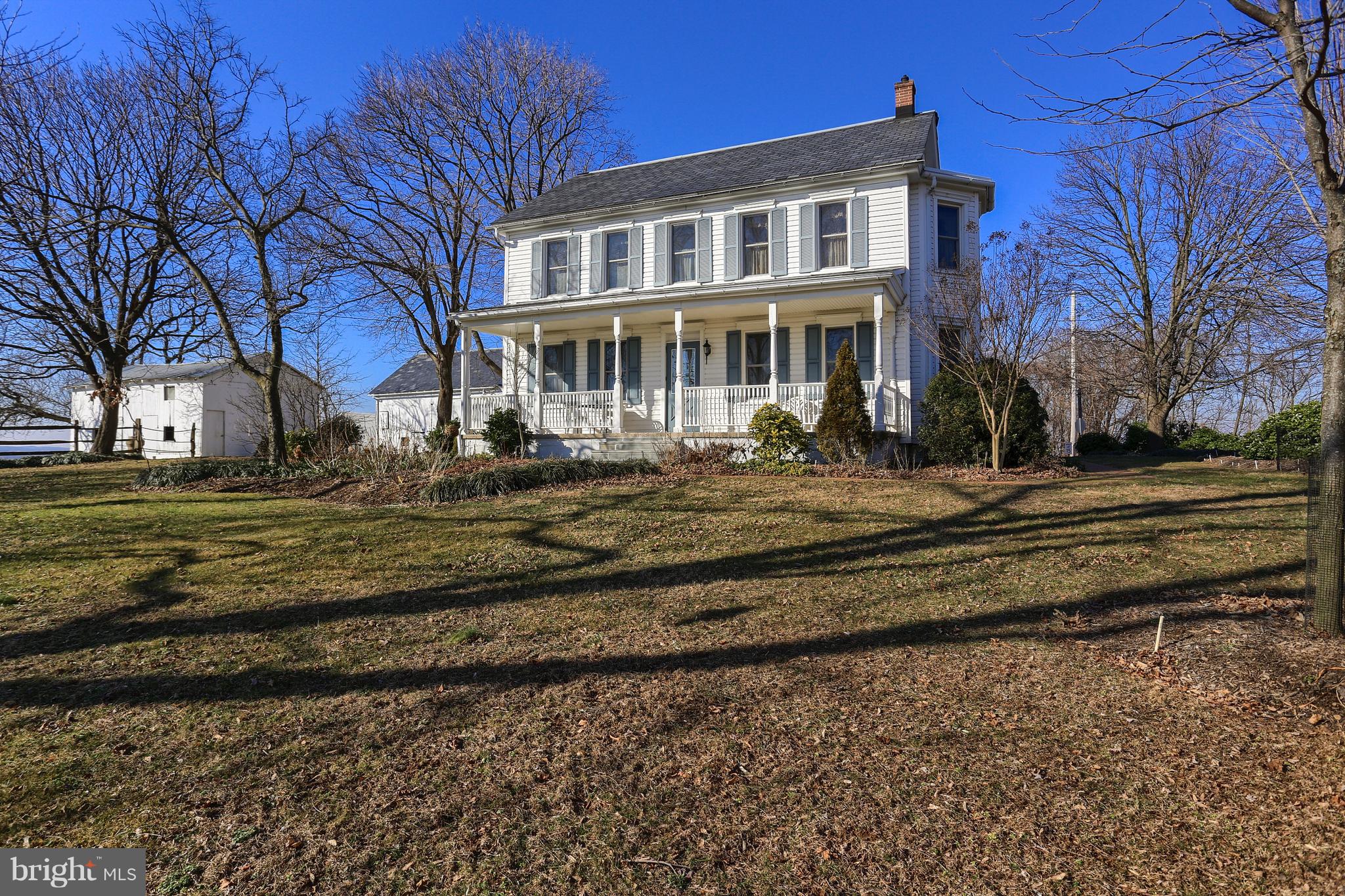Take in the beauty of this 100 year old Victorian Style Farmhouse with many updates that were chosen in order to maintain the architectural character of the home, while reducing its maintenance needs and increasing its energy efficiency.  Enjoy the gorgeous hardwood floors, 8' ceilings, Dual staircases, and wonderful & generous space throughout.  A delightful cook's eat-in kitchen (with unique copper vent hood system),  lovely formal Dining & Living Rooms  are wonderful ways to entertain rec & friends; while bright windows and doors drench this home with sunshine.  A pretty balcony & dual porches are a great way to enjoy nature.  Loaded with original woodwork & rich built-ins, this home has so many special nooks that you will never run out of areas to explore.  New high efficiency propane heating system newly installed Jan 2019/Newer siding, windows, & roofing are all high end products with long lifetime, high efficiency and low maintenance. The property is situated on 8.9 acres, with one acre surrounding the home landscaped for privacy and seasonal beauty with flowers, shrubs and trees that bloom from early spring through fall.  There are two barns & pastureland that is suitable for horses, and several farms nearby with horses.  6.5 of the acres are tillable. The property is located in a pleasant, rural location in the River Hills section of the southwestern area of Lancaster County,  with views of the Susquehanna River.  The area is rich with preserved farms, open land managed by the Lancaster County Conservancy and many miles of hiking trails.  It is close to Tucquan Glen, Kelly's Run, Reed Run, Trout Run, Steinman Run and Pinnacle Overlook.  An ideal setting for buyers looking for a peaceful setting in a community that prioritizes maintaining its beautiful country setting and character.