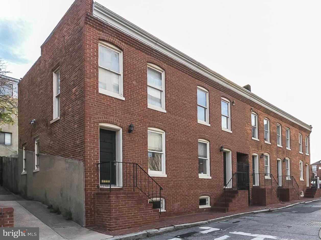 Available July 1st. Bright a2BR, 2BA home with a nice open layout - actually 2 small townhouse opened into 1 large home! Hardwood floors, wood-burning fireplace, and fantastic rear yard/patio. Lot's of storage in basement.  Master BR w en suite bath and large walk-in closet. Pets case by case. Parking avail for rent in lot next door for approx $140 monhly.  Lister must accompany.