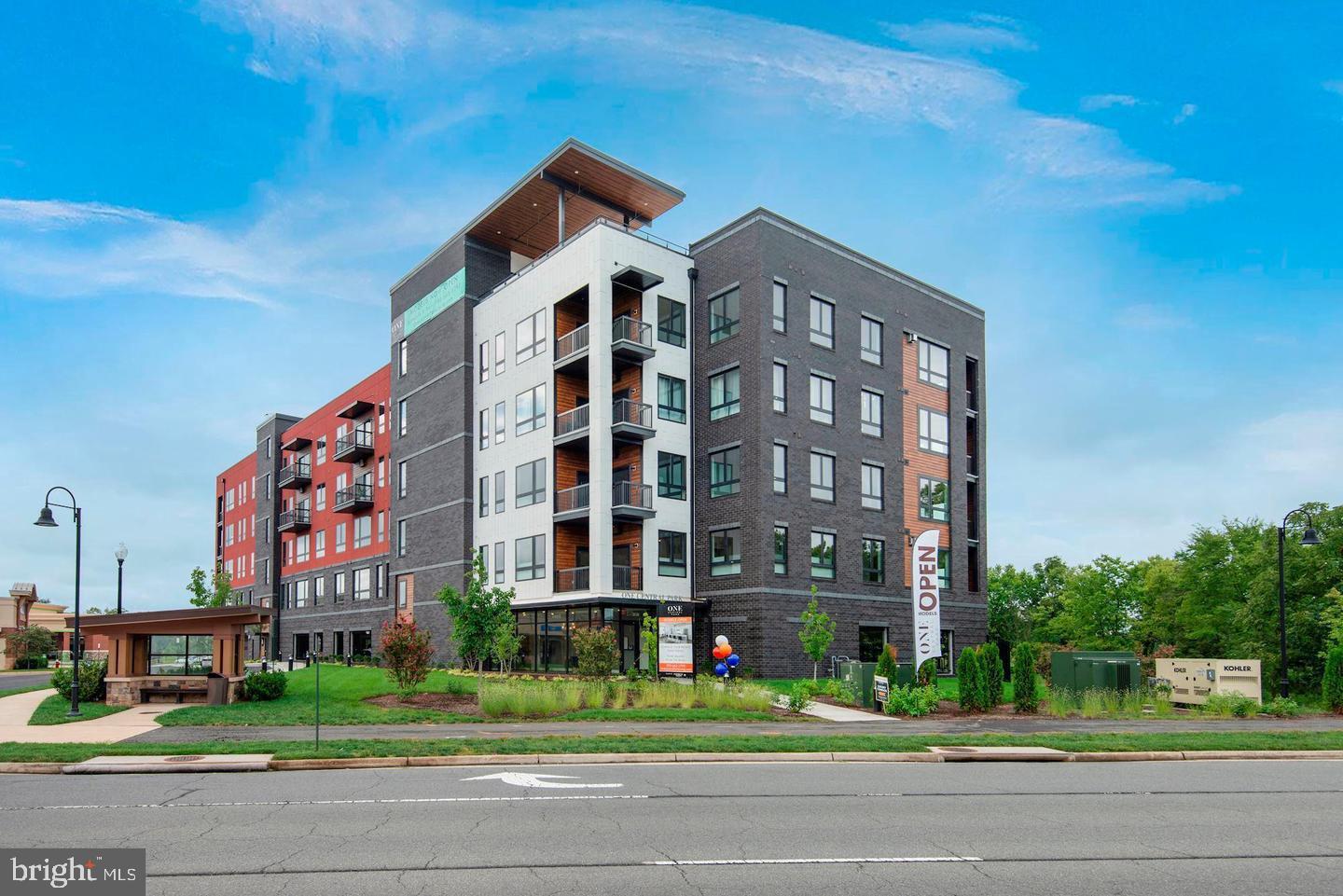 Welcome home to One Loudoun!  This stunning 3 Bedroom/2.5 Bath Luxury condominium was built in 2021. Boasting 1787 square feet of indoor living space, this home has 10 foot ceilings, quartz counters, SS Jenn-Air appliances, wide plank wood floors,  ample closet space, and full sized washer & dryer in separate laundry room.  Amenities include a roof top terrace with a fireplace & grill.  One parking spot included in the covered garage.  Pets welcome with deposit. Located walking distance from the shops & restaurants at One Loudoun, Trader Joe’s, iFLY indoor skydiving, and the Top Golf driving range.  Easy access to bus routes and commuting corridors.
