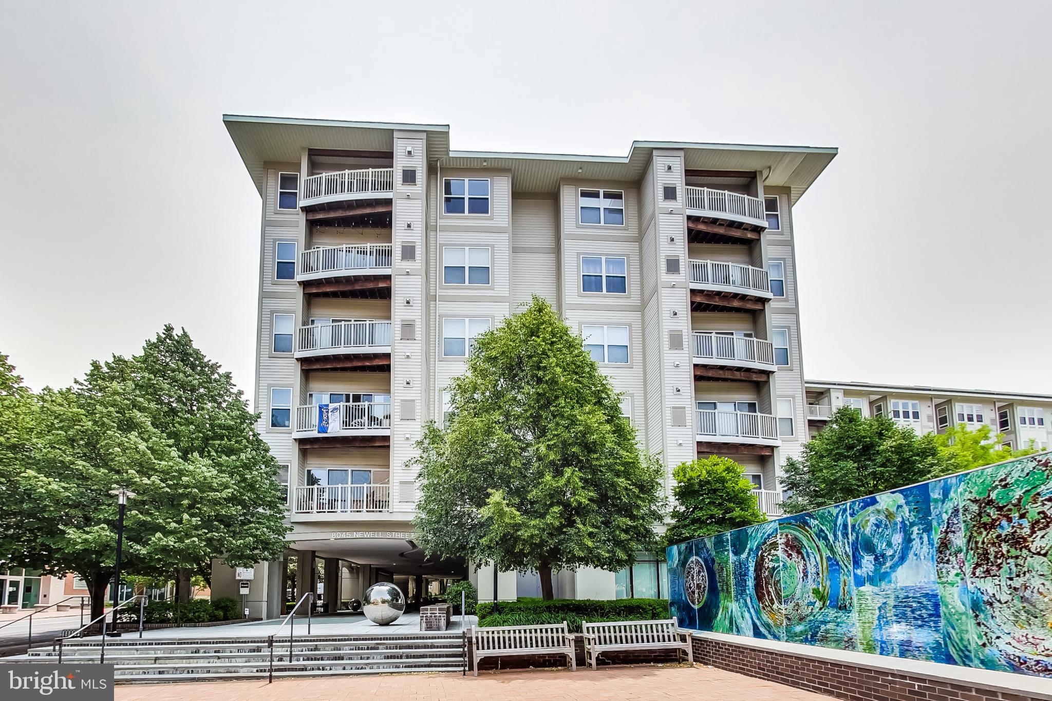 Welcome to modern living at its finest! Nestled in the heart of Silver Spring, this spacious 2-bedroom, 2-bathroom condo offers 1,220 square feet of thoughtfully designed living space in a sought-after midrise building its seamless open-concept layout and large windows, this home is filled with natural light, creating an inviting atmosphere perfect for relaxation or entertaining on the PRIVATE 258 square foot patio.

The well-equipped kitchen flows effortlessly into the living and dining areas, while both bedrooms provide generous space and privacy. Convenience is key with an in-unit washer and dryer, central heating, and air conditioning to keep you comfortable year-round.

8045 Newell Street is a pet-friendly, smoke-free building offering residents a fitness center, lounge, and shared outdoor patio. With a Walk Score of 94, you're just steps from grocery stores, Target, Ellsworth Place, and the Silver Spring Transit Center (Metro & MARC). The upcoming Purple Line will further enhance the convenience of this prime location.

Parking is worry-free and steps from the from door with one assigned space (number 6) included.  Additional garage access and on-site parking available for rent. An electric gate and security system provide peace of mind and ensure a sense of security within the community.

Conveniently located in Silver Spring with easy access to dining, shopping, and entertainment, this stunning property offers an unmatched combination of style, comfort, and practicality. Don’t miss the chance to make this condo your new home—schedule a showing today!