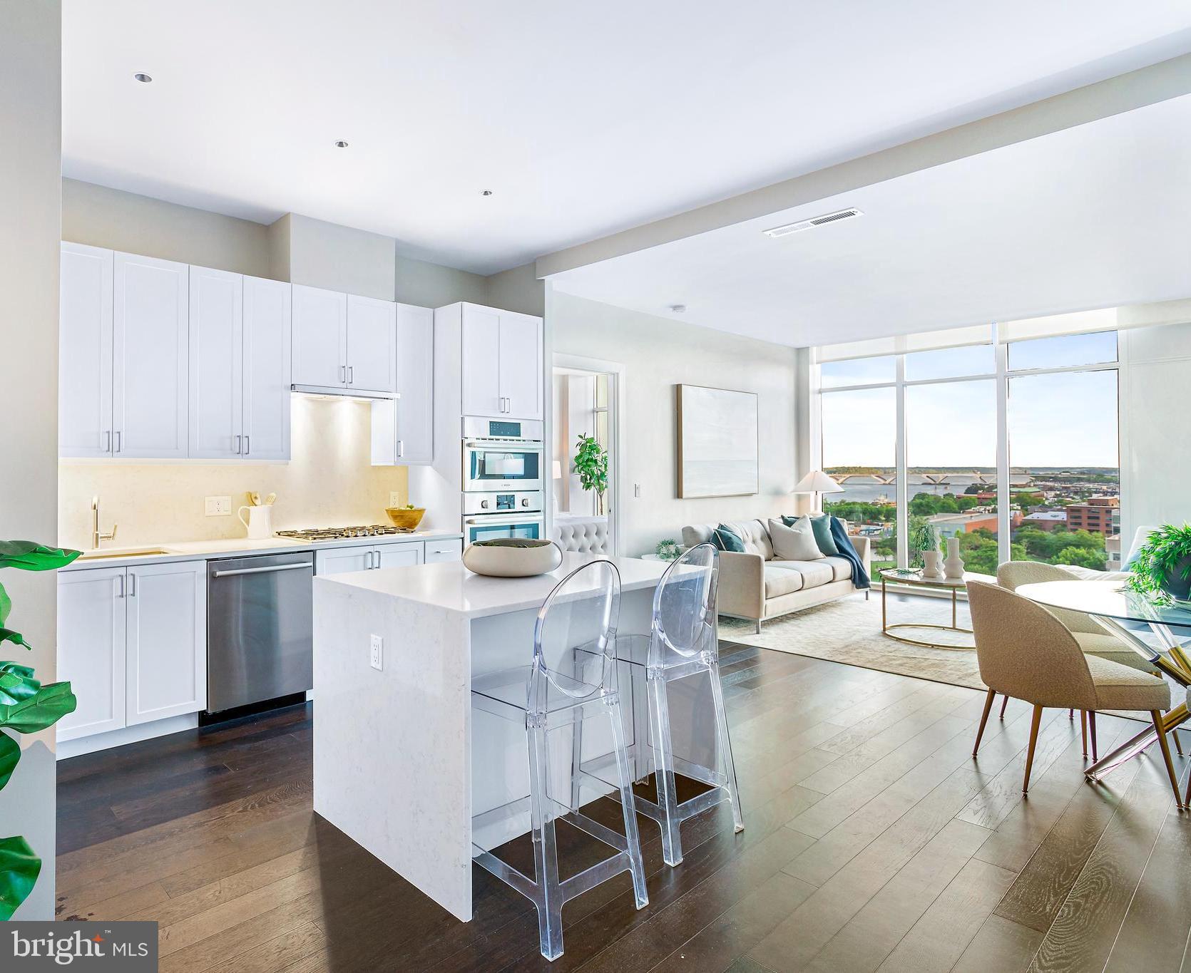 FINAL RELEASE/CLOSEOUT PRICING - JUST REDUCED FROM $1,749,900! BRAND NEW TWO-BEDROOM MODEL at Old Town's newest luxury condominium building, VENUE! Absolutely stunning in person, this is an incredible value for a 12th-floor two-bedroom on the South side (TONS of natural sunlight) with AMAZING views of the Potomac River, National Harbor, and South Old Town throughout! Built by renowned local developer, Carr Companies, the finishes in this building are extraordinary. Chef's kitchens feature Bosch appliance packages, Quartz countertops, and custom cabinetry. This particular floor plan was designed to utilize every inch with purpose, so it lives larger than 1260 sq ft and has 10ft ceilings throughout! The owner's bedroom with en-suite bath features a double vanity and walk-in shower with a 5-point showerhead and detachable nozzle. A total of 5 closest allow for ample storage including a MASSIVE walk-in closet in the owner's suite along with an extra large closet in the foyer. VENUE offers a turn-key elevated lifestyle. Enter through the hotel-style Porte-Cochere into our Grand Lobby, where you will be met by our Full Service Concierge and on-site building manager to assist with your every need. The building features a sprawling Rooftop Terrace offering expansive panoramic views of the DC Monuments, Potomac River, and Old Town skyline as well as an outdoor grilling station and fire pit seating area. The elegant indoor Owner's Sky Lounge is equipped with flat-screen TVs, a fireplace, and a cocktail bar, perfect for entertaining! Relieve your stress in the State-of-the-art Fitness center complete with a Barre studio. VENUE is the ideal location in Old Town's most desirable neighborhood, right in the center of entertainment, restaurants, and shopping, with direct access to the Mount Vernon Trail. This is a MUST SEE TWO BEDROOM!! Immediate occupancy is available. Come see what all the fuss is about!