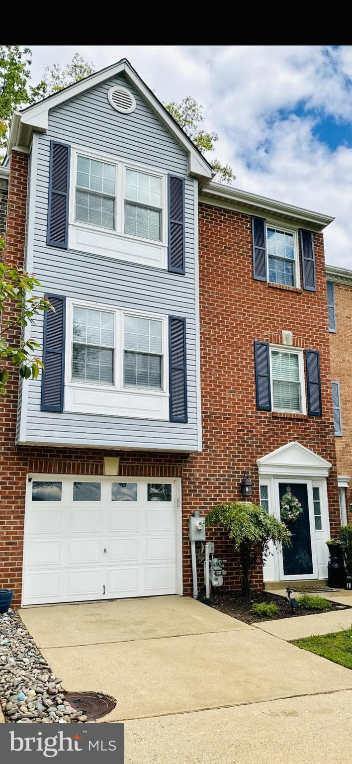 This townhome has it all!  Located in the desirable area of Bay Hills, amenities galore!  Walk to shopping, dining and other essentials without ever leaving the community!  This home fronts to Bay Hills Golf Course holes 3 and 4.  From the rear of home enjoy the wooded privacy and winter water views of Deep Creek.   Just steps away to the community pier and canoeing/kayaking.  The interior of this home affords three levels with a bath on each.  Entry level at grade can be accessed from the garage and includes a powder room and family room/4TH bedroom with gas fireplace and sliders to rear access and your own private sanctuary with patio area and hot tub!  The main living level boasts a spacious living room with an abundance of natural light.  The kitchen has been updated and includes plenty of cabinet storage and area to entertain.  Adjoining dining area leads to second story deck and fabulous views of wooded area and creek.  The upper level includes three bedrooms.  The primary bedroom with cathedral ceiling and luxury bath with soaking tub and separate shower.  Two additional bedrooms share use of the main upper level full bath.  This  wonderful home has it all from views, amenities, an award winning school district and comforts abound!