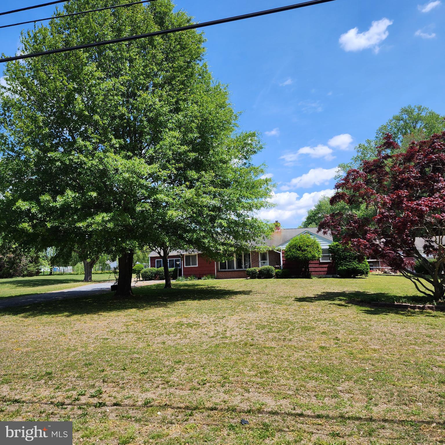 Opportunity awaits on this approximately 1.56-acre property in Milford featuring a spacious ranch-style home,  and additional carport space.

This 3-bedroom, 1.5-bath home offers approximately 1,588 square feet and presents a great opportunity for buyers looking to renovate, update, or invest in a property with land and potential. The home is not move-in ready and will require repairs and cosmetic improvements, but offers a functional layout and several existing features that could shine again with the right vision and updates.

Inside, you'll find generously sized living areas, a fireplace, large windows providing natural light, and a layout that offers flexibility for redesign and modernization. The kitchen and baths are dated, and portions of the home reflect deferred maintenance, creating an ideal project for investors, renovators, or buyers looking to build sweat equity.

Outside, the expansive lot provides room for gardening, hobbies, storage, or outdoor enjoyment. The additional covered parking add useful workspace and utility rarely found at this price point and lot size.

Property is being sold strictly as-is. Any inspections will be for informational purposes only.

Conveniently located near Route 1, Route 15, shopping, dining, and everyday amenities while still offering a more spacious setting with room to grow. This home will not qualify for FHA financing and if securing a mortgage will likely need a renovation loan.