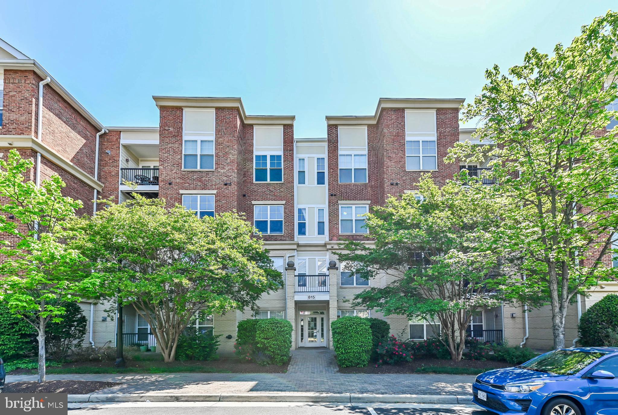 Enjoy the open floor plan of this charming, elevator accessible, penthouse unit, located a couple blocks from historic downtown Herndon and the W&OD bike trail.  Gleaming hardwood covers the flooring in the main rooms of the unit.  The primary suite includes a spacious ensuite bathroom with dual vanities and a separate tub and shower.  A large walk-in closet with convenient built-in shelving is one of the two closets completing  the primary suite.  Both bedrooms include ceiling fans providing additional temperature control and overhead lighting.  The gourmet kitchen includes gas cooking, a built-in microwave, loads of cabinets and an expansive breakfast bar for casual dining.  The kitchen opens to both the spacious living room and the formal dining room making the layout perfect for entertaining.    For a taste of the outdoors, step out onto the private balcony from the  living room for a view of trees below.  Recently updated washer and dryer are conveniently included in unit.  Go straight by elevator from your garage parking space (#30),  located in the gated underground parking garage to your fourth floor apartment.   Additional parking is available in the side parking lot and on the street.  Recent Updates: Fifty gallon hot water heater 3 years; Windows 4 years; Washer/Dryer 5 years.  Enjoy the treasures of downtown Herndon with all its restaurants, shops, the farmers market, the library, and much more!!
