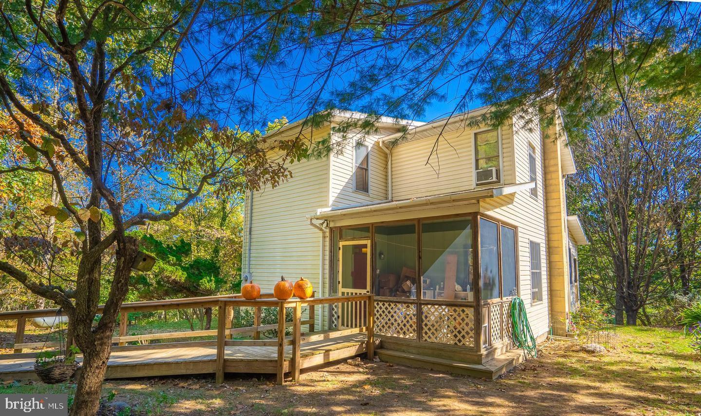 This awesome private mountain home sits on 7+ acres, ideal for gardening and country living. Highlights include a spacious deck, enclosed porch with beautiful mountain views. New appliances, roof, gutters, and water softener. Pine hardwood upstairs, and bamboo flooring on the main level. Unfinished walkout basement. Convenient to US Rt 522, Berkeley Springs, dining, and Cacapon State Park.