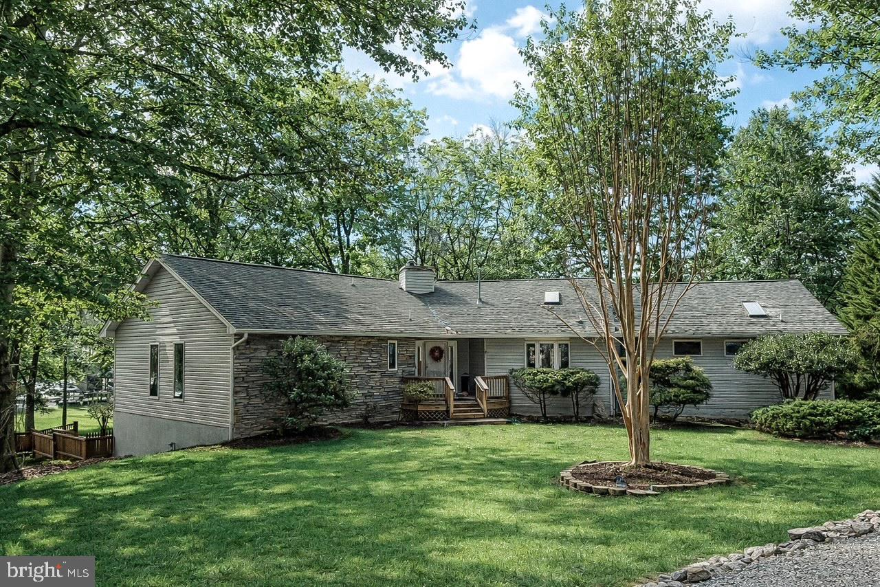 Welcome to your dream waterfront retreat in the highly sought-after Rockland Creek Community. Nestled inside a private gated community, this stunning 5-bedroom, 4-bath home offers the perfect blend of space, comfort, and unforgettable views. Designed with both entertaining and everyday living in mind, the open floor plan creates a seamless flow between the kitchen, dining, and living areas — ideal for gathering with family and friends. Expansive windows fill the home with natural light while showcasing peaceful waterfront scenery that sets the stage for unforgettable sunsets and cherished moments. Step outside to the spacious screened-in porch, the perfect spot to enjoy your morning coffee, unwind in the evenings, or host relaxed waterfront dinners — all while taking in the breeze without the bugs.
For boating enthusiasts, the private boathouse with two boat lifts makes lake days effortless. Whether it’s early morning fishing trips, afternoon cruises, or sunset rides, everything you need is right in your backyard.
With five generously sized bedrooms and four full baths, there’s room for everyone to spread out comfortably. This home offers tons of space to create lasting family memories — from holiday celebrations to summer gatherings by the water. Located in the desirable Rockland Creek Community, residents enjoy the added privacy of a gated entrance along with access to a well-maintained common area — perfect for recreation and connecting with neighbors.

Even better — everything conveys with the sale, including furniture & Golf Cart. This is truly a turnkey waterfront opportunity, ready for you to start enjoying from day one.

This is more than a house — it’s a lifestyle.

Schedule your private showing today.