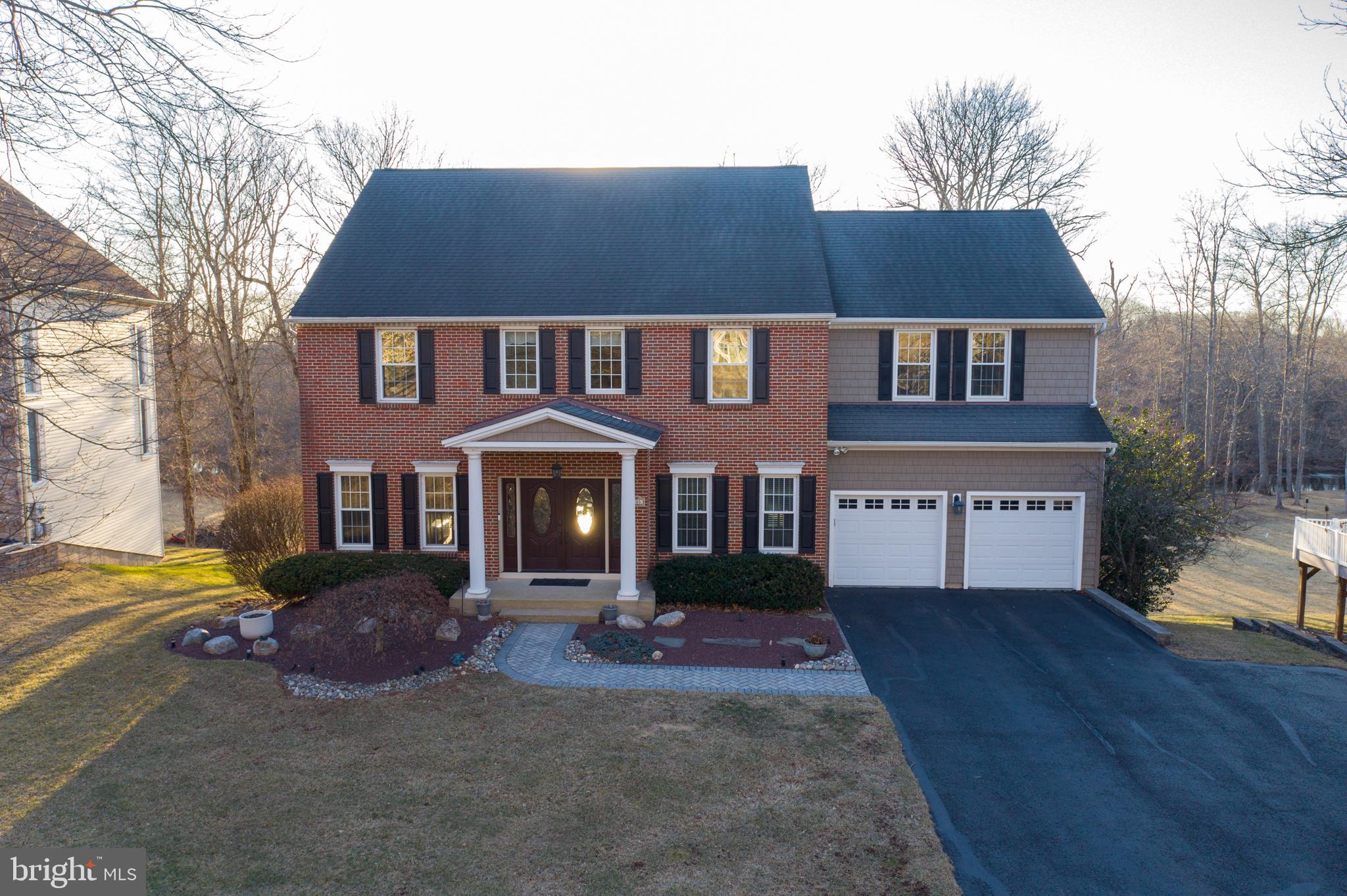 This stunning 4-bedroom home seamlessly blends luxury, modern convenience, and timeless elegance, offering 2 full and 2 half baths with spacious, light-filled living areas and soaring 9-foot ceilings throughout. New Singleton triple-pane windows (installed just three years ago) bathe the interiors in natural light while enhancing the home's refined appeal.  At the heart of the home, the gourmet kitchen has been thoughtfully expanded to include a versatile butler’s pantry and wine area, complete with a dual-zone wine fridge. An additional 200-amp electrical box was installed with the kitchen addition, ensuring ample power for future needs.   Step outside and be captivated by the meticulously maintained,  landscaped grounds, which provide both beauty and privacy. The property also grants exclusive riparian rights to the middle of the creek, offering a serene, natural retreat right in your backyard.  Inside, sophisticated custom crown molding graces both the first and second floors, faux wood blackout blinds are installed on all windows throughout the home, ensuring complete privacy and light control.. The primary suite is a true sanctuary, featuring a custom-built bureau/vanity, a cozy window seat with hidden storage, and a California Closets-designed walk-in closet. The ensuite bathroom is a showstopper, boasting a large walk-in shower, exquisite tile flooring, dual sinks, and a private water closet with its own sink for ultimate convenience.  Each additional bedroom is designed with crown molding, custom California closet systems, and ceiling fans for year-round comfort. A dedicated second-floor laundry room and two oversized hallway closets provide exceptional storage solutions. The dual-zone HVAC system ensures optimal climate control in every season.  On the first floor, the private office/study with pocket doors offers a quiet space for remote work or reading. The family room, centered around a charming wood-burning fireplace, is ideal for cozy gatherings.  The finished walk out  basement expands your living space, featuring a custom bar with a kegerator, additional beverage fridge, surround sound hardwired throughout, and a half bath—perfect for entertaining.  Step outside to your backyard retreat, where a spacious deck invites relaxation with a hot tub, TV mount pre-wired for cable, and breathtaking views of the lush yard and creek. A shed provides extra storage, ensuring a clutter-free outdoor oasis.

This home enjoys a prime location, just minutes from Doylestown, Montgomeryville, and scenic Lake Galena at Peace Valley Park. Enjoy top-tier dining, boutique shopping, and cultural attractions in Bucks County, with easy access to Routes 202, 309, and the Chalfont train station. Golf enthusiasts will love the proximity to several public and private courses.

Situated on one of the largest lots in the development, within the award-winning Central Bucks School District, this home offers a rare blend of elegance, modern updates, and thoughtful design.
Don’t miss your opportunity to own this exceptional property—schedule your showing today!