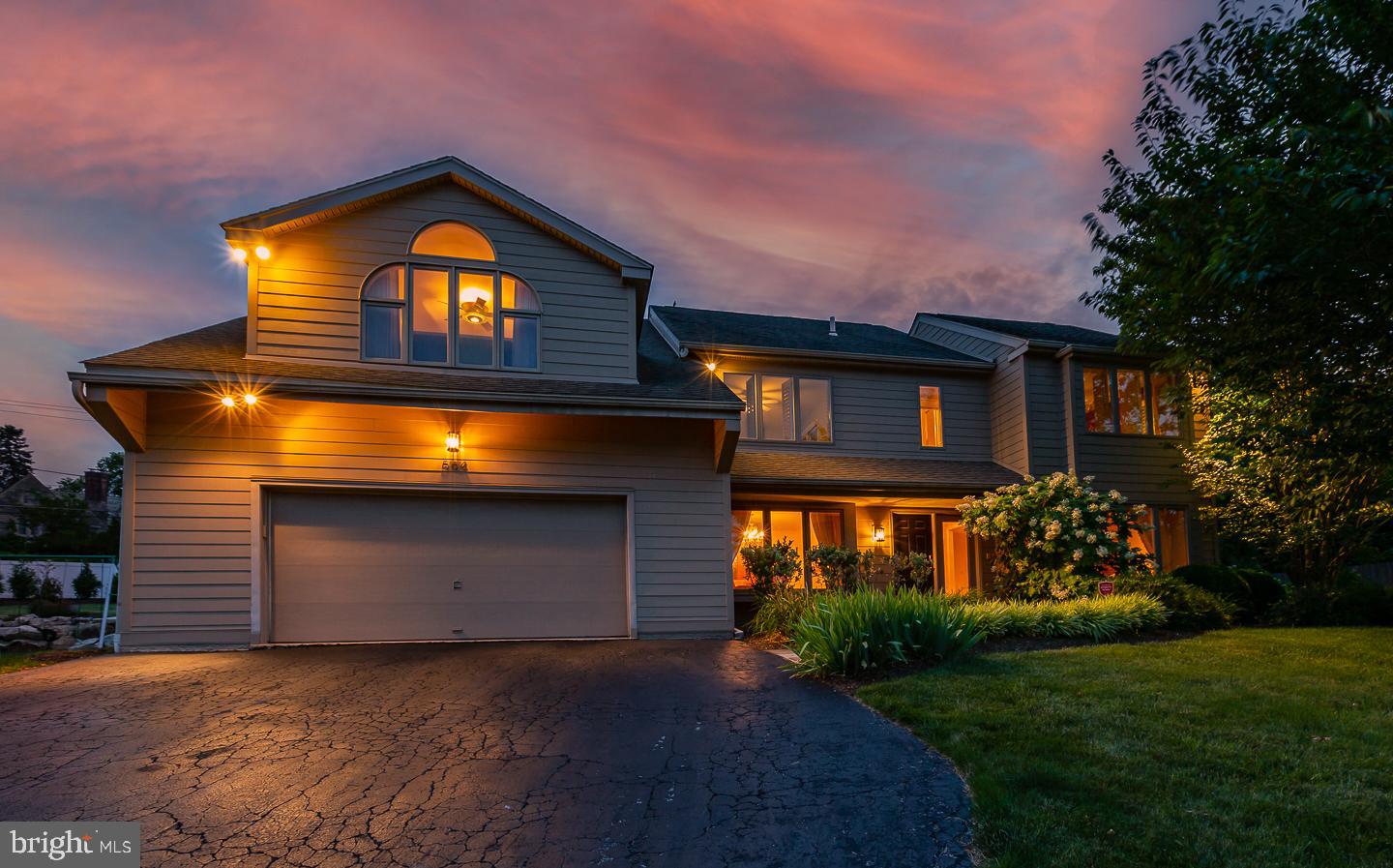 A beautifully maintained and improved property in the sought after Indian Creek neighborhood, known for its quiet cul-de-sacs and sidewalks. As one of the larger homes in the neighborhood, this 5 bedroom 4.5 bathroom home is move in ready with over 4,000 sq. ft. of living space as well as a finished lower level that offers a full bath, bonus 6th bedroom, family room and storage. With ample space and tasteful improvements, this home provides a luxurious home sanctuary for today’s modern family. Enjoy professionally landscaped gardens and new Hardi board full home exterior, new windows, and skylights. The entrance has marble floors, a powder room, and a coat closet. On either side of the foyer are the formal dining room and living room, both with large bay windows and oak hardwood floors. Both rooms could easily be used as a study or office. In the back of the home a two story high, large family room with skylights and stone gas fireplace make for a comfortable space to entertain and relax. The living room extends to the back patio and yard as well as into a renovated gourmet eat in kitchen with bay windows and skylights. The kitchen features a stainless steel Subzero refrigerator (2020) Thermador double ovens and gas range, Bosch dishwasher, solid brass faucet, solid wood custom cabinetry with “soft close” cabinets and more. Extending off the kitchen is a second large sun filled family room that leads to the laundry room with storage and an oversized attached garage with additional built-in shelves and storage room. Both family rooms have oak hardwood floors. Head upstairs to an oversized primary suite with oak hardwood floors, barrel ceiling, gas fireplace, and a generous walk-in closet. The primary bathroom is sunny and spacious with high ceilings and includes double sink, a jetted bath and double shower. The primary suite is designed so that someone could get ready in the bathroom and closet without disturbing a sleeping partner. 4 bedrooms, one with en suite bathroom, and a hallway bathroom complete the second floor. All bedrooms are equipped with built-in shelving in the closets. The basement provides an additional full bathroom, bonus bedroom, family room, cedar closet and ample storage as well as a room plumbed for a sink that could be created into a kitchenette or additional laundry room. This property has been meticulously maintained, with new landscaping and slate walkway, new Hardi board full exterior (2021-22), several new windows and skylights (2020-22) Newer 3 zones of high efficiency HVAC with wifi thermostat and more. Located in the award winning Lower Merion school district, a commuters dream perfectly distanced to Center City, PHL Airport, King of Prussia business districts, University City and everything the Main Line has to offer. This unique and peaceful, sidewalk community offers a true neighborhood experience and a tranquil place to retreat from the fast pace of everyday life.