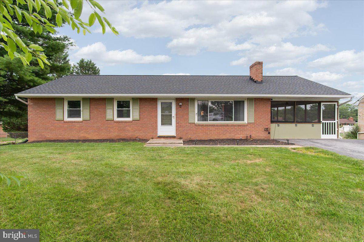 Nestled on a quiet cul-de-sac in desirable Williamsport, this brick rancher offers a fenced rear yard, walkout lower level, and a long list of recent improvements. A brand-new roof with transferable warranty, fresh paint, new carpeting, replacement windows, and a newer water heater provide peace of mind and a fresh, move-in-ready feel. Inside, you'll find hardwood floors throughout the main level, a kitchen with stainless steel appliances, and a dining area just off the kitchen. The main level offers three bedrooms and one-and-a-half baths, while the screened side porch provides a wonderful additional living space to relax, entertain, or enjoy the outdoors. The huge finished walkout lower level offers exceptional flexibility with a spacious rec room, true fourth bedroom, laundry area, and abundant storage space. Whether you need room for guests, hobbies, a home office, workout area, or recreation space, there's plenty of room to make it your own. Plenty of driveway parking and a convenient location close to schools, shopping, dining, parks, and commuter routes complete the package. Offering a great combination of space, updates, and value, this home is ready for its next owner.