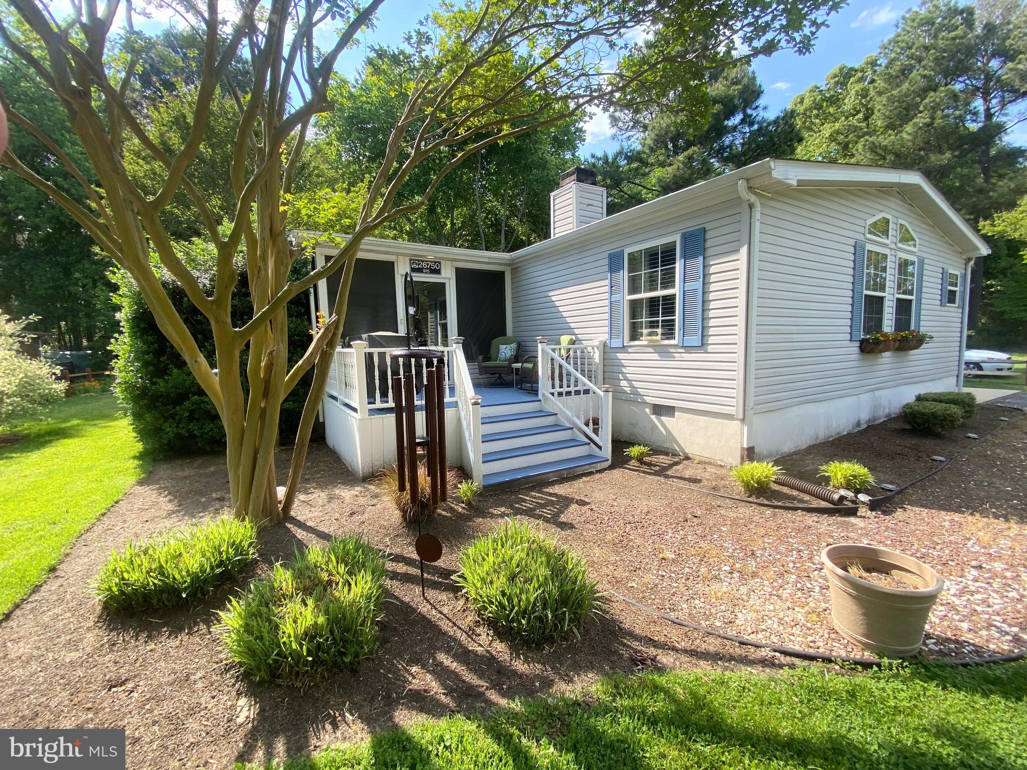 Discover your dream retreat in this stunning 3-bedroom, 2-bathroom home nestled in the tranquil Pot-Nets Bayside community, backing up to lush woodlands and offering picturesque views of Turtle Pond. Spanning over 1,700 sq ft, this residence is perfect for both relaxation and entertaining, featuring elegant vaulted ceilings, a chef’s kitchen with upgraded appliances and a spacious island, and a dining area highlighted by a beautiful chandelier. The cozy living room, complete with a stone propane fireplace and built-in bookshelves, invites you to unwind on chilly evenings.

The primary suite is a true sanctuary, boasting a walk-in closet and a spa-like ensuite bath with a walk-in shower and an LED fireplace for added comfort. Guests will appreciate the spacious guest rooms and bath, while the serene screened porch and beautiful deck provide ideal spaces for gatherings. With access to a private beach on the Indian River Bay and a spacious carport with a workshop for your beach toys, this home offers a vibrant Bayside lifestyle that awaits your arrival.

Lot rent reflected the 2026 monthly rate