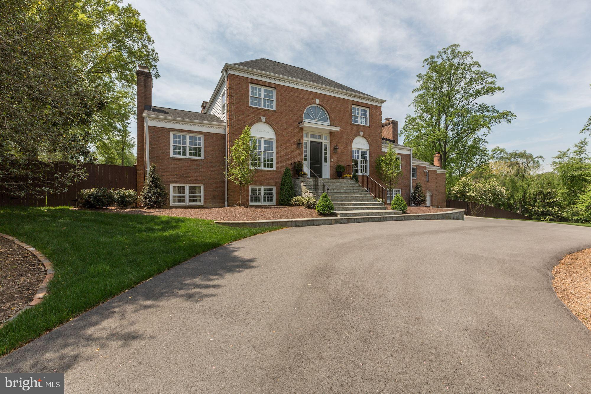 Exquisitely renovated brick colonial in one of the most desirable locations in McLean, just one stop light to DC! A dramatic two story foyer opens to the exceptionally spacious Living Room with a fireplace, built-ins and rich hardwood floors. There is a gorgeous Kitchen with top-ofthe-line appliances and a crisp clean design that opens to an exceptional Dining Room with Fireplace and has access to the Screened in Porch. A cozy Family Room off the Kitchen is surrounded by windows. Continuing in the Main Floor, there are four generous sized Bedrooms and Gym that over-looksthe Indoor Sports Court that feature floor to ceiling windows. The Upper Level Owner's Bedroom is a retreat with Sitting Room, Study, gorgeous spa like Master Bath and spacious Walk-in Closet. The Lower Level Recreation Room has a Wet Bar, two Bedrooms, two full Baths and Mud Room with built-in storage cabinets.  Sprawling Backyard has Pool, Outdoor Kitchen that includes a built -in grill and Green Egg.