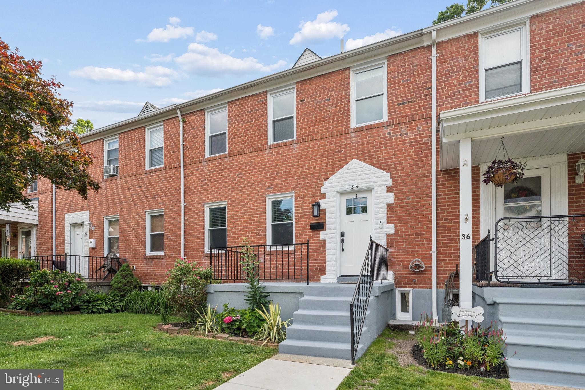 Beautifully renovated brick townhome offering 4 bedrooms and 2 full baths in a convenient location. This move-in ready home features a bright, open main level with luxury flooring, recessed lighting, and a stunning updated kitchen complete with white cabinetry, quartz countertops, stainless steel appliances, and a large center island perfect for entertaining. The upper level offers three spacious bedrooms and an updated full bath. The fully finished lower level provides additional living space with a fourth bedroom, second full bath, laundry area, and flexible space ideal for a family room, guest suite, home office, or gym. Enjoy outdoor living in the fully fenced rear yard featuring a covered rear porch, new deck, and private patio area. Fresh updates throughout provide modern style and functionality while maintaining classic charm. Conveniently located near shopping, dining, parks, schools, and major commuter routes.