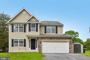 Beautiful 5 bedroom home in highly sought after area in Howard County. Close to all major commuter routes. Less than 20 minutes to Fort Meade/NSA, 10 min to MARC train to DC, 95, 100, 695, 29, and BWI. Coupled with extremely close proximity to Rockburn Park, and the Patapsco Sate Park, this home has the work/ play balance with space to entertain. Enter into the home and be welcomed with a formal living room and dining room with brand new hardwood floors that continue through the entire first level. Head toward the rear of the home and you have the Kitchen/family room combo with access to the expansive screened in porch. Great outdoor space overlooking the tiered hardscaped patio and almost 2/3 acre property. Back inside, the basement is 3/4 finished with a rec room, spare bedroom , full bathroom and abundant storage. On the upper level, you will find 3 generously sized bedrooms (some with walk-in closets) and full bath and finally the spacious primary suite, 3 closets and spa bath with separate shower and soaking tub.   Great school  and.... No HOA or front foot.