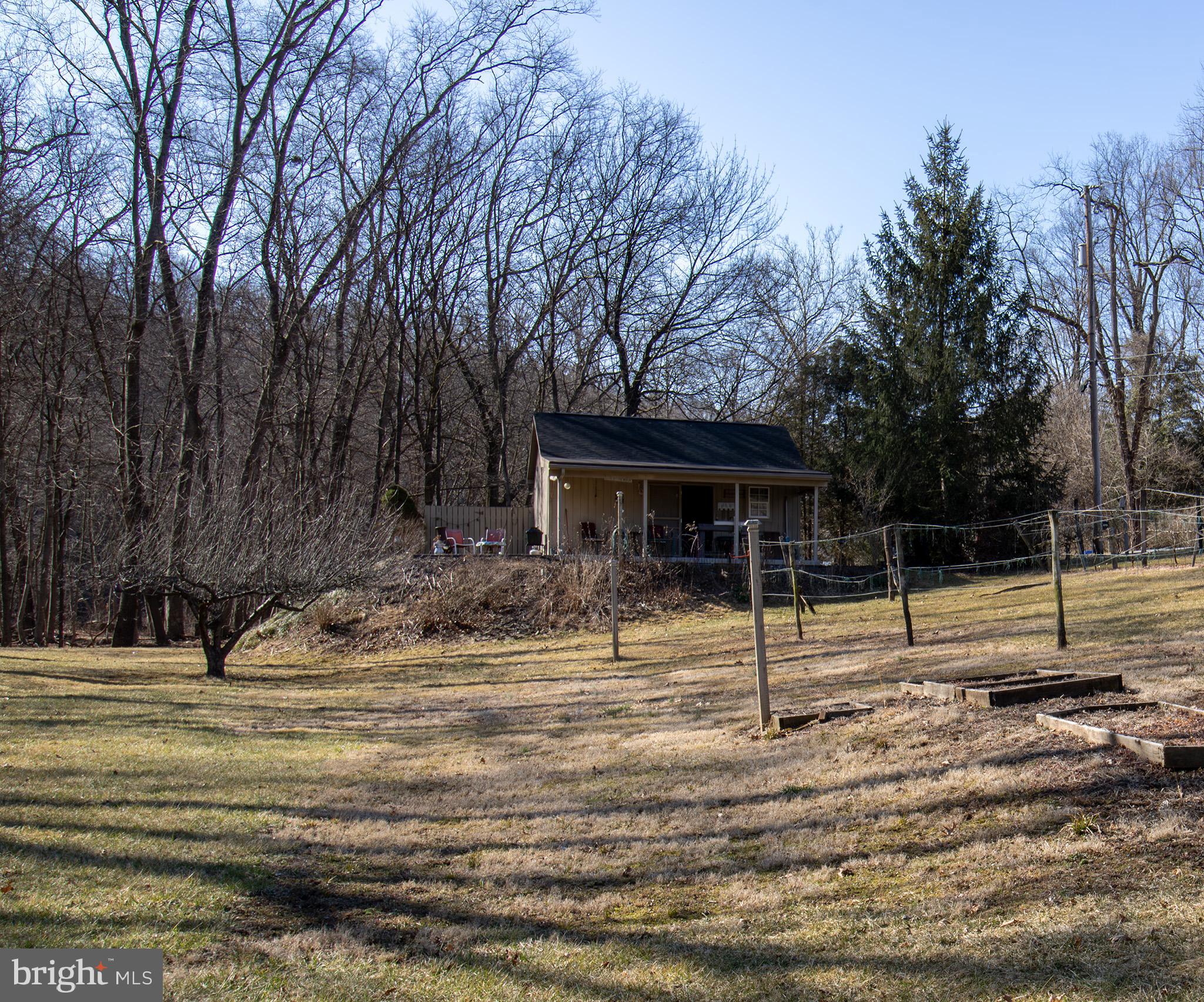 A waterfront retreat by the Conewago Creek.  A prime fishing destination known for its natural beauty and tranquility, it has been used as the current owners special place and fishing location for over 70 years. Previously used for wine production, the property features established rows of grapevines, perfect for hobby winemakers or those looking to continue its legacy. Plenty of land for gardening.  The property features two sheds, the largest shed has a composting toilet for off-grid convenience, and it feels like a cozy rustic cabin. With an existing well and public sewer availability, the property provides flexibility for future development. Whether you're seeking a fishing getaway, vineyard, private weekend retreat or looking to build your creekside dream home this unique piece of land presents endless possibilities. Contact Newberry Township to verify your ideas. It's a must see and spring is near!