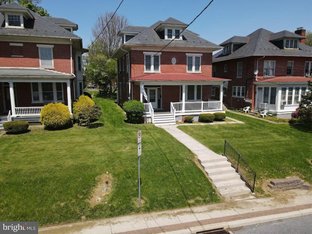 This property will be offered at Public Auction on Thursday, June 18, 2026 @ 6pm.  The listing price is the opening bid only and in no way reflects the final sale price.  10% down due at auction, 2% transfer tax to be paid by the purchaser, real estate taxes prorated. Parcel 1 (67 W. Frederick St) is well cared for and ready for a new family. It features a functional layout with a welcoming entryway, living room, spacious kitchen, and dining room on the first floor. The second floor offers four bedrooms and a full bathroom. The basement is currently unfinished, providing excellent potential for storage. Additional amenities include off-street parking accessed from an alley off N. Prince Street, a spacious front porch, and a detached garage.