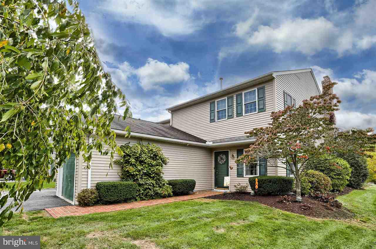 Spacious end unit in Grandview Park surrounded by walking trail & golf course.  Beautiful condo with nearly 2000 sq ft of space.  Possible first floor bedroom with first floor full bath & laundry room.  Two oversized bedrooms and full bath remain on the second floor along with loft area.  Double french doors lead to the fenced in private stamped concrete patio with retractable awning.  Move in ready & maintenance free.