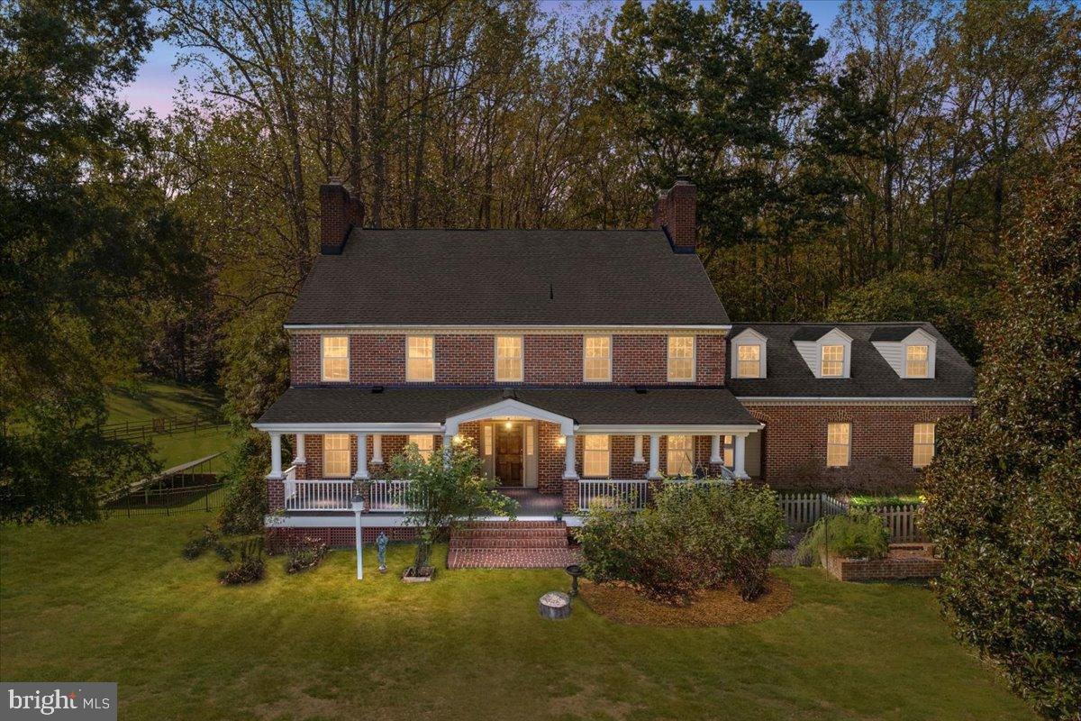 Gorgeous Sustainable Estate on 5 Acres.  Nestled on five largely **wooded, private acres**, this exceptional 6-bedroom, 6-full-bath sanctuary offers a peaceful retreat where classic charm perfectly meets modern, **sustainable luxury**. The home has been meticulously updated with **substantial sustainable upgrades** to provide **efficient, low-cost living** without compromising on comfort or style.  Elegant Interiors and Flexible Living   Step inside to a spacious, beautifully appointed home featuring elegant **hardwood floors** and four cozy **wood-burning fireplaces**. The **main level** offers remarkable flexibility, hosting a generous living room and a dining room with its own fireplace. The **gourmet kitchen** is a chef's delight, boasting soft white cabinetry, a **professional 6-burner gas range** with two electric ovens, and a large picture window with stunning views. This level also includes a bedroom, a full bath, and a dedicated office, all easily accessible from the driveway via a discreet **Trex ramp**.  Upstairs, the accommodations are plentiful and luxurious. The huge **primary bedroom suite** is a true sanctuary, featuring a sun-filled ensuite bath designed for ultimate relaxation, complete with a classic **clawfoot soaking tub**, a large shower, and a double vanity. A second bedroom also enjoys the privacy of an ensuite bath. The upper level is thoughtfully laid out with three bedrooms and three full baths on one side of the house, plus an additional, private bedroom and full bath situated over the two-car garage.  The expansive **walk-out basement** adds tremendous living space, featuring a recreation room, a media room, another bedroom and full bath, and a luxurious **sauna**.   Low-Cost, Energy-Conscious Living  This home is designed for the modern, energy-conscious homeowner. Thanks to installed **solar panels**, you will enjoy incredibly **low utility bills**—as low as $15 in sunny months, with an average of only $185 even while charging an electric car! Comfort is ensured year-round by a **new heat pump** (electric with propane backup), and a **whole-house generator** provides dependable backup power. Practical updates include a new roof installed in 2020, and you will also appreciate the **tons of storage** found throughout the property.  Idyllic Outdoor Sanctuary   Outdoor beauty is abundant, whether you are relaxing on the expansive **Trex deck** at the back of the home or enjoying the incredible covered front porch, complete with a classic **porch swing**. The beautiful, wooded lot is enhanced by mature landscaping, including a striking specimen **magnolia tree** and a thriving small **orchard** with six apple trees, a productive fig tree, and several pear trees. This unique property offers a rare blend of natural tranquility and modern, energy-conscious living—a true haven for the nature lover in all of us.