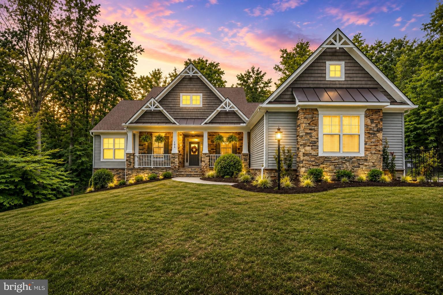 Move-in ready and beautifully maintained custom-built rambler with primary on the main! This impressive former model home offers over 4,300 square feet of beautifully finished living space across 2 finished levels, showcasing countless upgrades and a thoughtfully designed open floor plan filled with natural light. Designed for both everyday living and unforgettable entertaining, this exceptional home seamlessly blends luxury, comfort, and functionality in every space. 
The main level features gleaming hardwood floors, a spectacular gourmet kitchen with two oversized islands, a spacious family room with a cozy fireplace, a private office or flex room, a formal dining room, and the must-have butler's pantry. Step outside to the expansive composite deck overlooking a park-like setting, where exceptional privacy and a peaceful natural backdrop create the perfect place to relax or entertain. The walkout lower-level patio extends your outdoor living space, making entertaining family and friends effortless. 
Upstairs, the luxurious primary suite features an elegant tray ceiling and a spa-inspired ensuite bath, creating the perfect private retreat. Two additional generously sized bedrooms complete the upper level. 
The finished walkout lower level offers outstanding versatility with a large second family room, two additional bedrooms, custom storage areas, and direct access to your own private backyard retreat. 
Perfectly situated on 3+ private acres, this remarkable home also features a 3-car garage, offering the ideal blend of luxury, space, and privacy. With too many upgrades to list, this former model home showcases exceptional craftsmanship, designer finishes, and thoughtfully designed living spaces throughout. From the incredible indoor and outdoor entertaining areas to the peaceful natural setting, this is a rare opportunity to own a truly one-of-a-kind property that is sure to impress. 
Some photos have been virtually staged to help showcase the home's layout and design possibilities. Furniture and décor shown in the virtually staged images are for illustrative purposes only and may or may not be physically present in the home.