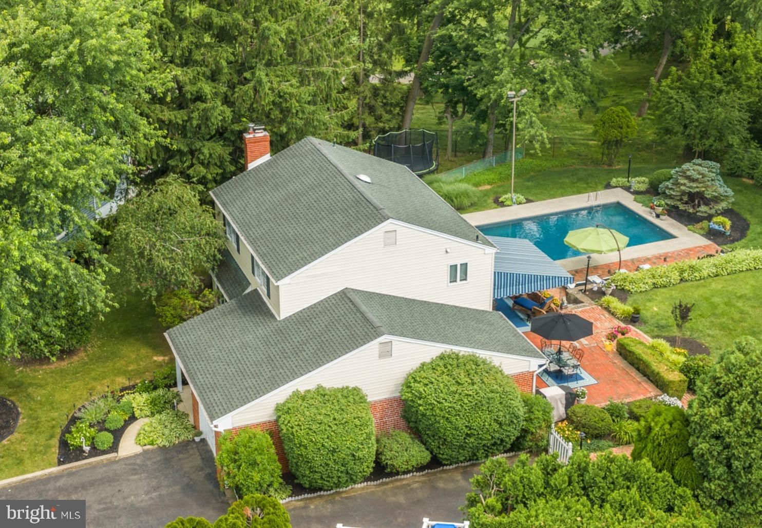 Welcome home to resort-style living on a generously sized Springfield lot, backing directly to the prestigious Rolling Green Golf Club. 217 Hemlock Ln is a true gem nestled in the highly sought-after Rolling Green Neighborhood, located within Blue Ribbon Award winning Springfield School District. The true showstopper here is the backyard - a tiered oasis featuring a 20x40 gunite, gas-heated in-ground pool on the lower level for endless summer days, with a flat, usable upper yard that keeps the space functional and enjoyable even in the off-season. Entertain under the covered, brick-paved patio with the awning providing shade year round, all while taking in unobstructed views of the golf course beyond. And yes, it is fully fenced for our furry friends.
Inside, this beautifully maintained 4-bedroom home offers space and comfort at every turn. The remodeled kitchen (2019) with new stainless steel refrigerator and dishwasher (2022) flows effortlessly into the family room where oversized windows overlook the picturesque backyard, keeping you connected to the action whether you're cooking, entertaining, or simply soaking in the view. The inviting living room centers around a cozy gas fireplace, perfect for cooler evenings and flows effortlessly into a formal dining room anchored by a dazzling crystal chandelier. A convenient half bath completes the main level. Upstairs, generously sized bedrooms offer comfortable retreats, including a primary suite with a beautifully renovated bath (2023-2024). Two full bathrooms serve the upper level with ease.
The finished lower walkout level adds incredible bonus living space, complete with a second fireplace (electric), a half bathroom, a dedicated home office, and flexible recreation space.The lower level also features a dedicated laundry area AND a custom built in bar. 
Major systems have been thoughtfully updated for true peace of mind, including a new HVAC heating and cooling system (2021), new hot water heater (2021), updated light fixtures, and a radon mitigation system (2020). An attached garage, 220 amp electrical service, brand new awning and pool cover, and meticulous care throughout round out this exceptional property.This is a home where every major update has already been done, so all that's left to do is move in and enjoy.