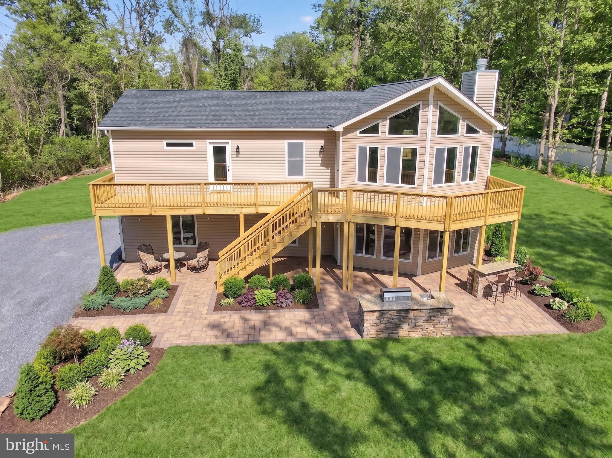Ready for new owners!  This stunning new construction home is set on over an acre of level land with private lake access, offering the perfect blend of modern comfort and peaceful surroundings.  Paved roads to the property, a rare find.   Thoughtfully designed with upgrades throughout, the home features vaulted ceilings, wood burning fireplace, and luxury vinyl plank flooring across the main living areas.

The open-concept floor plan seamlessly connects the great room and kitchen, creating an inviting space ideal for entertaining. The kitchen is beautifully appointed with granite countertops, stainless steel appliances, abundant cabinetry, and generous counter space.

The primary suite provides a relaxing retreat, complete with an upgraded luxury bath featuring a large tiled shower and a walk-in closet. Main-level laundry adds everyday convenience.

The full basement is filled with natural light and includes a rough-in for a future full bath, offering excellent potential for a family room, additional bedroom, or flexible living space. Basement-level access to the two-car garage enhances functionality.

Outdoor living is a highlight, featuring a full-length front deck perfect for relaxing and enjoying the views, as well as a 12’ x 10’ rear porch ideal for outdoor dining or entertaining.

Located within a Sanitary District, with fees conveniently paid through real estate taxes, this property also offers high-speed internet, making it ideal for working from home. Enjoy easy access to I-66 and I-81, along with nearby hiking trails, wineries, restaurants, and more.  Photos have been virtually staged, landscaping, patio virtually staged