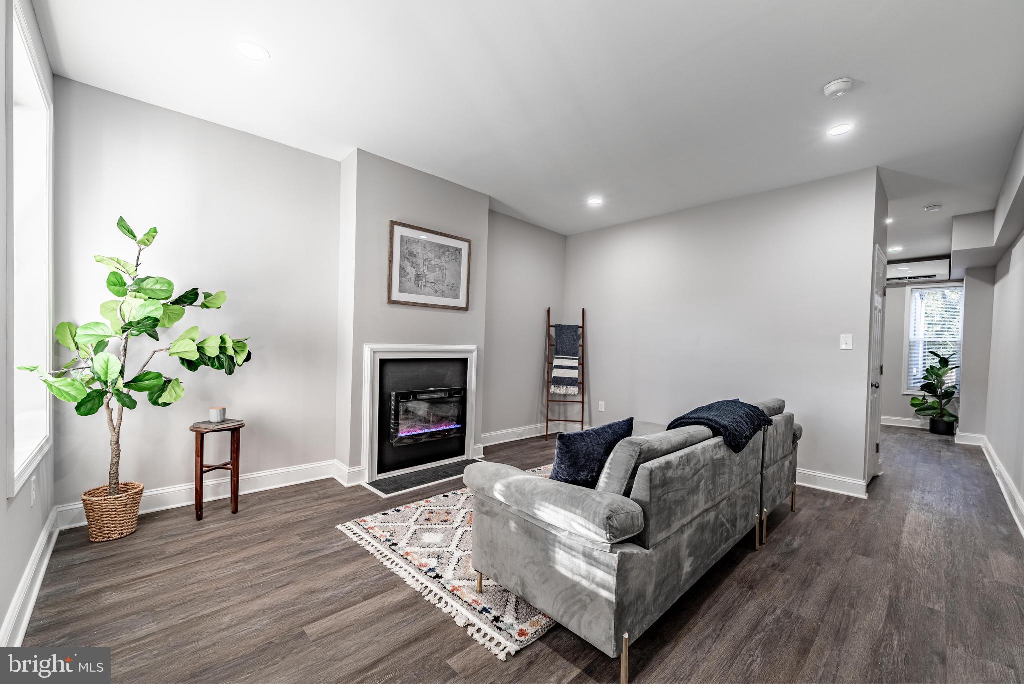 ******* Sellers are motivated! Bring all offers! **********************
 
Discover this beautifully reimagined rowhome in the lively Hampden neighborhood, ideally located at 708 W 34th St—right along one of Baltimore’s most treasured residential streets. Known around the world for the annual Miracle on 34th Street celebration, this iconic block comes alive each year with dazzling lights, tradition, and an incredible sense of community. Homes here rarely become available, and it’s even more special to find one on the desirable even side of the street, where the handsome three-story residences sit gracefully elevated above the avenue.  This home seamlessly blends timeless character with refined modern updates. Step inside to an inviting open-concept main level featuring durable wide-plank flooring, recessed lighting, and an effortless flow designed for comfortable everyday living and easy entertaining. The living room centers around a sleek electric fireplace, creating a warm and contemporary focal point. In the dining area, a dramatic floor-to-ceiling natural stone accent wall adds texture and visual impact.  The kitchen is thoughtfully designed for both style and function, offering crisp white shaker cabinetry accented by brushed nickel hardware, granite countertops, a gray subway tile backsplash, and a full suite of stainless-steel GE appliances.  Upstairs, generous bedrooms provide peaceful retreats, complete with plush neutral carpeting and oversized windows that fill the home with natural light. High-efficiency ductless mini-split systems in the primary suite and additional living spaces allow for customizable, year-round comfort. The updated full bath features a modern stone-topped vanity, designer lighting, and a beautifully tiled tub surround.  Additional features include a clean, dry basement with original stone foundation walls—perfect for storage, a workshop, or potential future finishing—as well as a new high-efficiency water heater. Just moments from the acclaimed restaurants, boutiques, and nightlife along Hampden’s “The Avenue,” this move-in-ready residence presents a rare opportunity to own a fully renovated home on one of Baltimore’s most celebrated streets. For added peace of mind, the sale includes a home warranty, offering confidence and protection for the next owner.