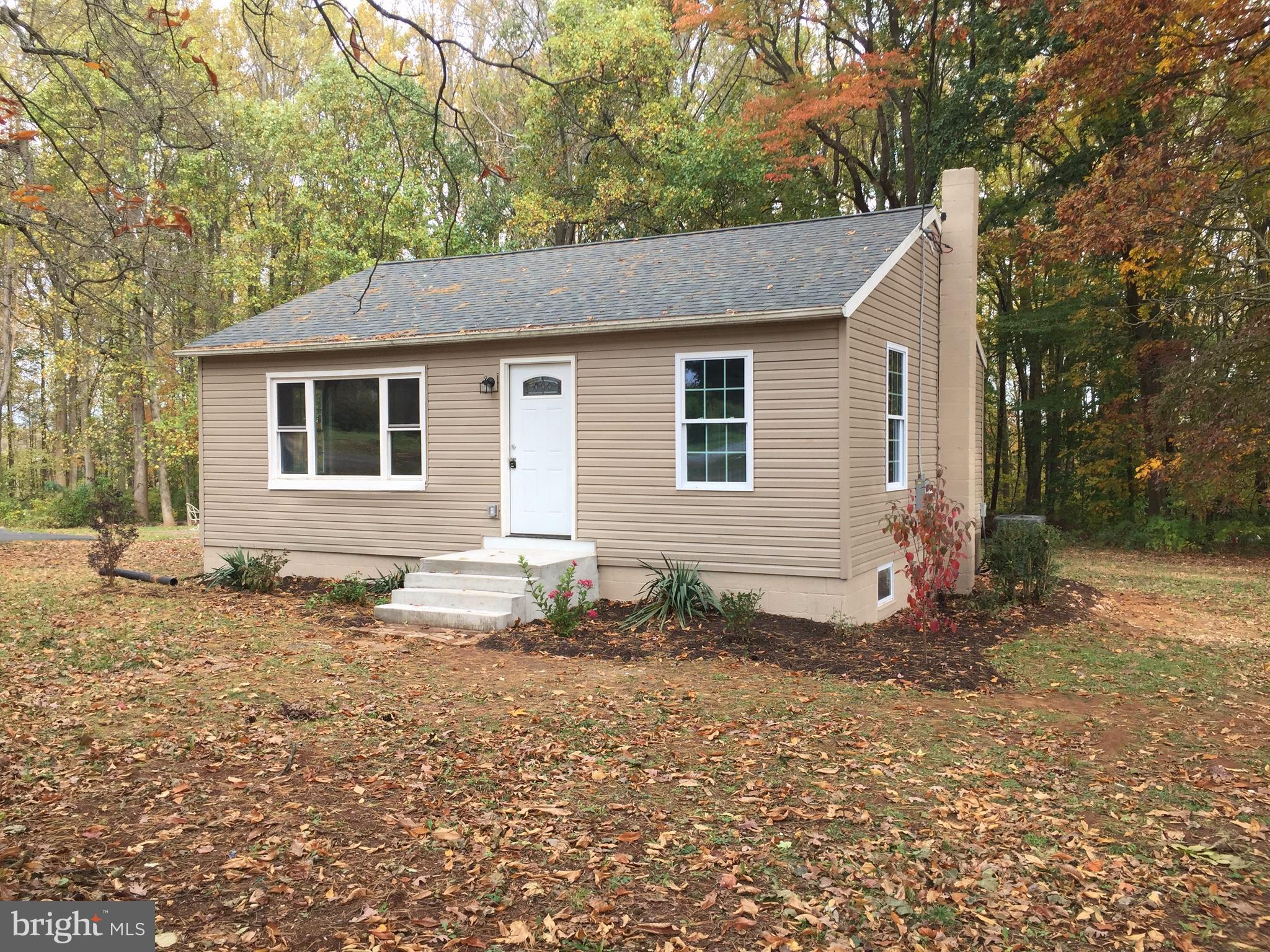 Freshly remodeled charming property on a wooded lot. This two bedroom home has been completely redone, and is ready for you to call home. Large open kitchen opens through french doors onto the new deck that overlooks your private backyard. Natural sunlight abounds here, and the neutral colors make this one a winner in anyone's book. Ideally located just off  Rt. One. See it today!