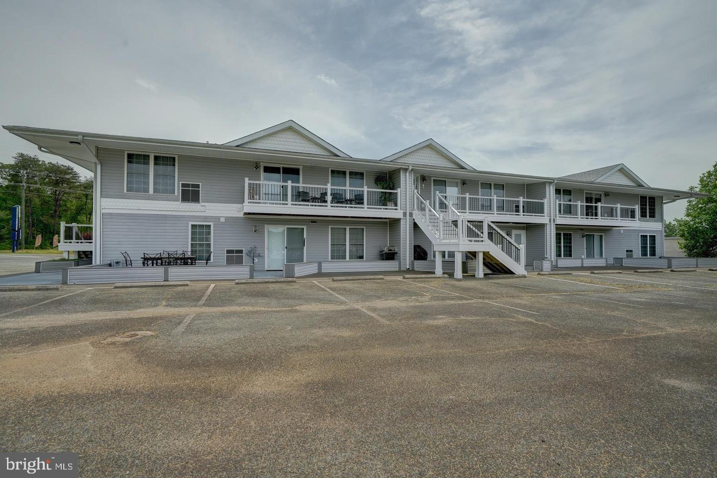Completely furnished lakeside condo with dedicated boat slip on Lake Anna! A fantastic getaway awaits inside this tastefully decorated, 1,260 square foot condo, located just up from the water. Lakeside-retreat offers you two spacious bedrooms, two full bathrooms, a large living area, eating area, an open kitchen, and high-speed Comcast Xfinity internet availability. The primary bedroom is large, includes a sitting area, two full size beds and a large walk-in closet. The second bedroom is similarly and has 2 full size beds as well. Currently sleeps eight.  Large patio area for outside entertaining and take a short walk down to your own boat slip in the community's private water access, perfect for boat launching, swimming, fishing and relaxing. Condo association rules prohibit stays longer than 30-days, which makes this a weekend getaway or an investment opportunity. Turn-key, completely furnished and decorated condo. Location is at the center of lake, close to restaurants, bars, groceries, vet clinic, nail spa, and the Lake Anna State Park.