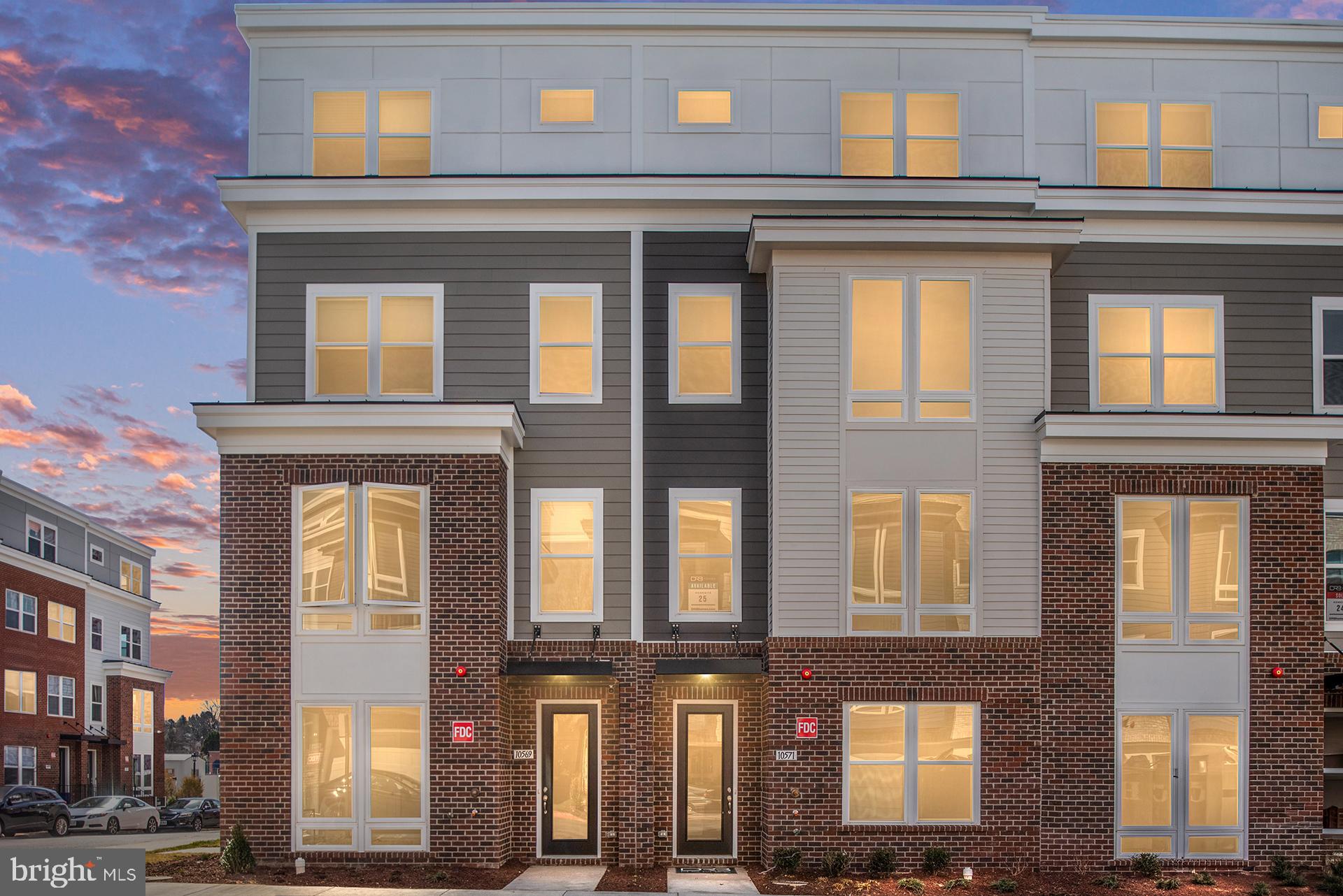*OFFERING UP TO 20K IN CLOSING ASSISTANCE WITH USE OF PREFERRED LENDER AND TITLE.* 
Beautifully designed 4-level Cary townhome boasting over 2,600 Sq. Ft. of living space and a 2-car rear-load garage. As you step inside, you’re welcomed by a spacious foyer that opens to a den and a convenient lower-level powder room. Ascend the oak stairs to the main living space, where you’ll find the centrally located gourmet kitchen featuring stainless steel appliances, a pantry, upgraded cabinetry, quartz countertops, and a spacious island. The kitchen seamlessly opens to the dining room and the family room, which offers direct access to the rear deck. Continue to the third floor to find a retreat in the primary suite, offering a spacious walk-in closet and a private bathroom featuring a dual sink vanity with quartz countertops and a walk-in shower. Two additional bedrooms, a hall bathroom with quartz countertops, and a conveniently located laundry room complete the third level. The fourth level features a bedroom, full bathroom, and a spacious loft that opens to a large rooftop terrace, providing an ideal space for outdoor living. Located in Northfax West near the intersection of Route 123 and Route 50, this new construction home offers convenience and luxury in a prime location.
