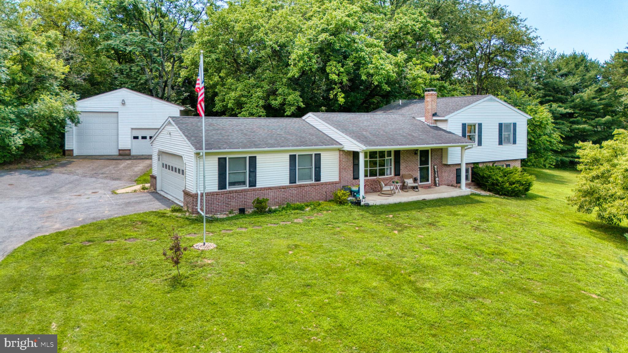 Welcome to 35 Hearthside Drive! This stunning home is nestled on just over an acre and ideally located just minutes from Interstate 81. The beautifully landscaped lot is accented by mature trees, offering both charm and privacy. The spacious backyard features a tall, coated chain link fence, creating a secluded retreat perfect for relaxing or entertaining. A standout feature of the property is the massive detached garage, large enough to accommodate an RV and recently updated with a commercial-grade garage door opener. In addition, the home includes an attached two-car garage, providing plenty of space for parking and storage. Inside, you’ll be welcomed by a bright and inviting living room with a large bay window that fills the space with natural light. The adjacent kitchen and dining areas showcase stylish flooring and a tasteful tile backsplash. Just off the dining room is a delightful sunroom, perfect for enjoying your morning coffee or soaking up the sun. Upstairs, you’ll find two generously sized bedrooms, each with its own full bathroom. The finished basement offers endless possibilities, it includes a large bathroom with an integrated laundry area, as well as versatile space ideal for a home office, recreation room, or additional bedroom. A brand-new pellet stove adds comfort and efficiency to the home. Don’t miss the opportunity to make this incredible property yours—schedule your private showing today.