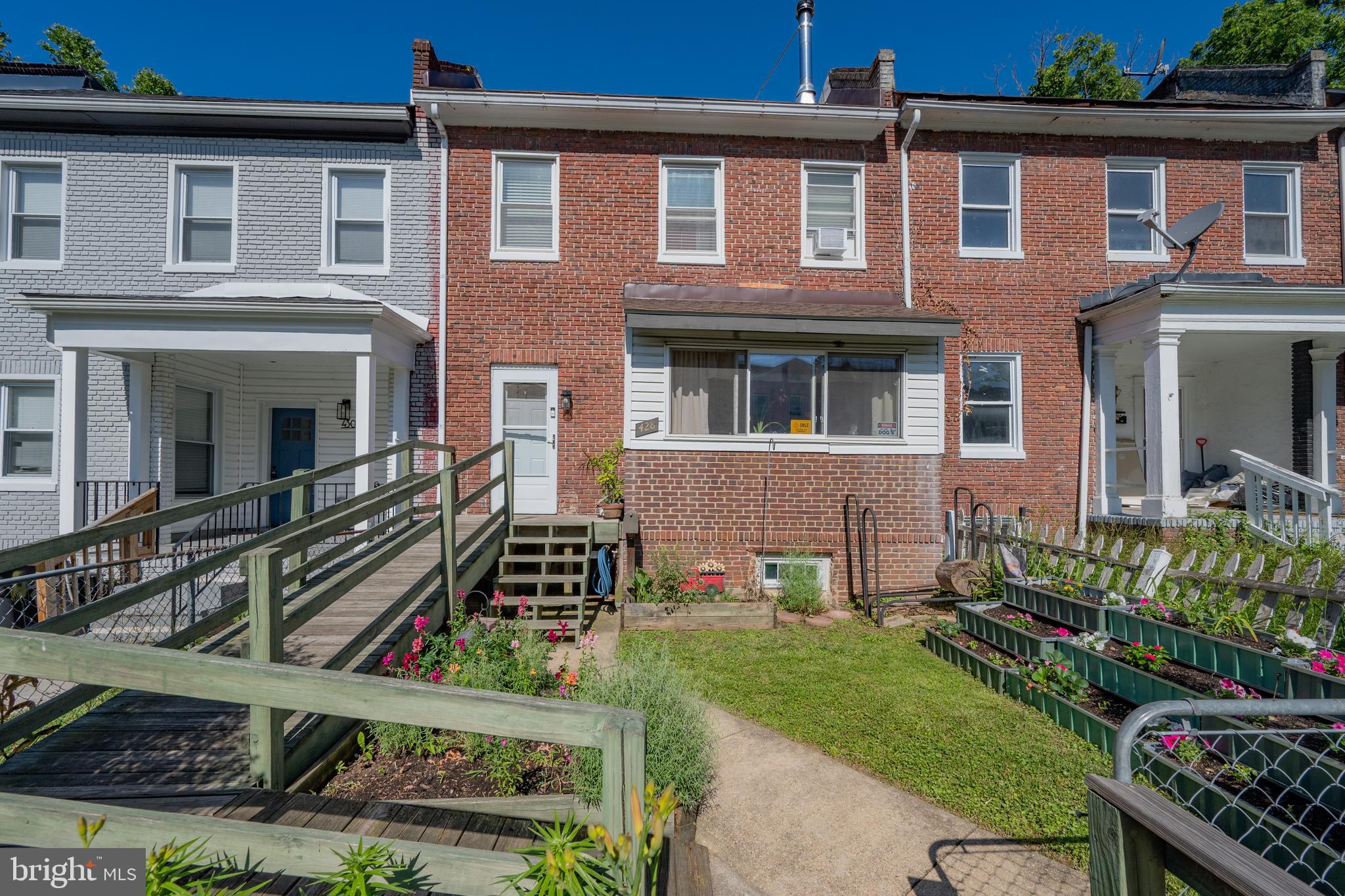 Charming, light filled, and lovingly maintained, this Baltimore City townhouse combines timeless character with extensive modern updates on a dead end block. The kitchen features granite countertops, solid wood cabinetry, and a beautifully preserved, fully functional Chambers stove, a rare and sought after centerpiece that reflects the home's unique charm. Thompson Creek double-pane windows fill the home with natural light while enhancing comfort and efficiency.  Major improvements provide peace of mind, including a complete electrical upgrade and heavy up with new service line in 2019, fully updated plumbing in 2020, a new water heater, an upgraded wood stove, and a new roof in 2020 featuring a skylight and 50 year shingles.  Step outside to a lovely deck replaced in 2020, perfect for entertaining, relaxing, or enjoying your morning coffee. This is a home that has been truly cared for, offering a rare combination of warmth, character, and significant system updates.