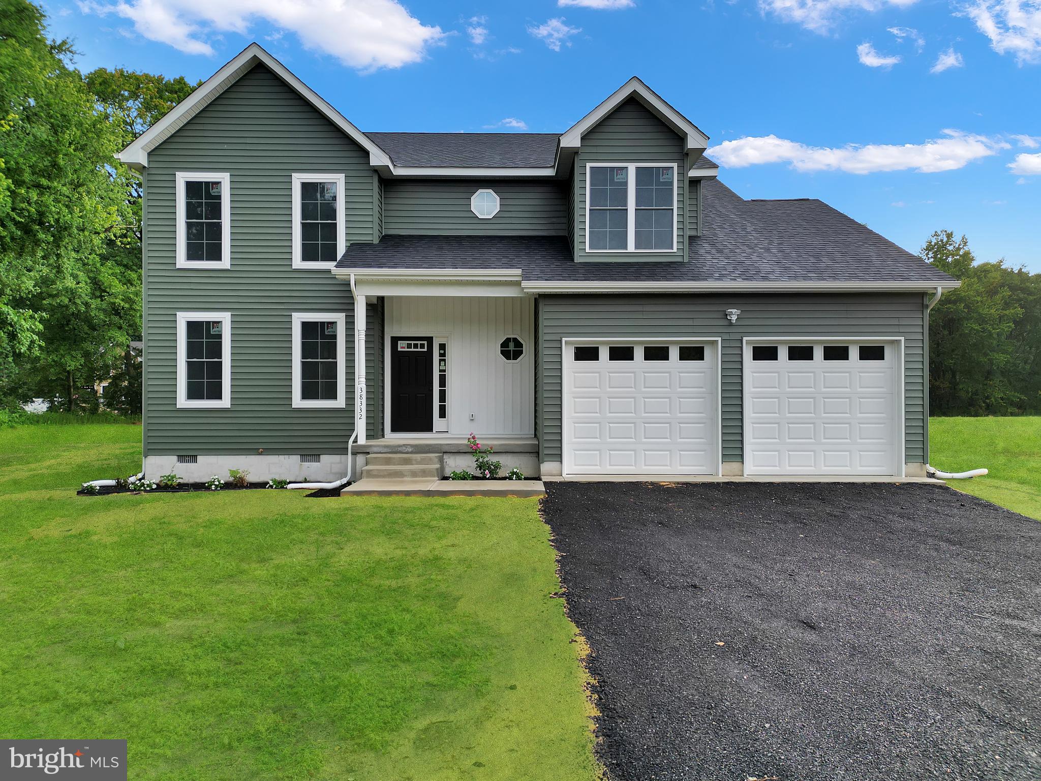 Located in the countryside of northeast Delmar, DE, this well-built 4-bedroom, 2.5-bath home offers the perfect blend of quality construction and everyday comfort. Inside, you’ll find LVP and tile flooring throughout. Both a breakfast room and a separate formal dining room, ideal for everyday living and entertaining alike. The kitchen is thoughtfully designed with stainless steel appliances, a center island, and upgraded countertops, complemented by stylish light fixtures and recessed lighting. A convenient half bath completes the first floor. Upstairs, the primary suite provides a relaxing retreat, while three additional bedrooms share a full bath. Bathrooms feature tile flooring and solid surface countertops. Outside, enjoy the rear deck for outdoor relaxation, along with a low-maintenance exterior. Additional features include finished and painted interior garage walls. This home truly offers all the conveniences to make living here a pleasure.