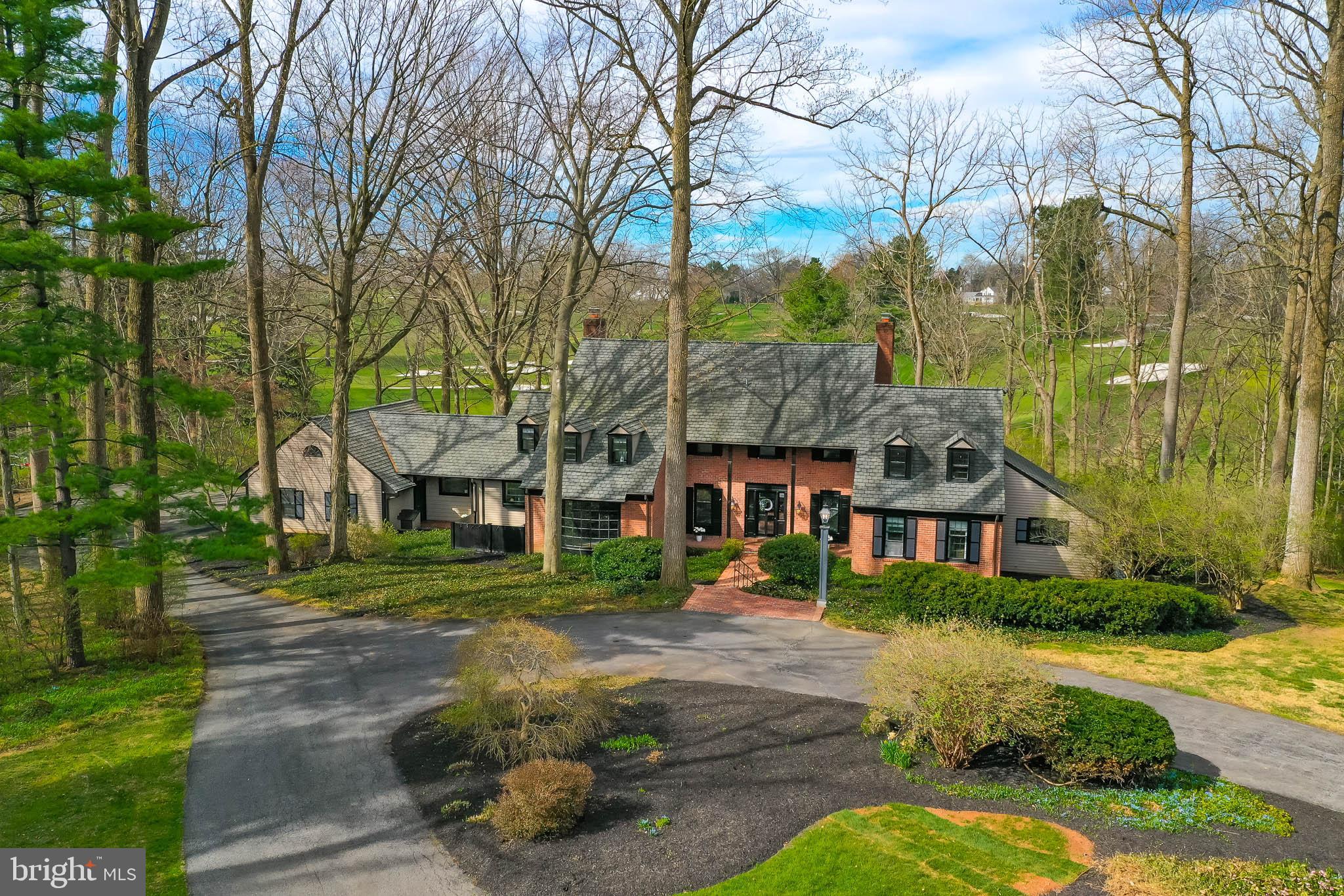 Experience refined luxury at one of the most exclusive addresses in Lancaster County, set on 2.5 beautifully landscaped acres with panoramic views of the famous Lancaster Country Club golf course. Located in a cul-de-sac at the end of prestigious Eshelman Road, this expansive custom-built home blends timeless architecture with recent upgrades, including fresh paint, new carpet, updated lighting, and built-in Sonos surround sound. The main level offers multiple large living and entertaining spaces with sunlight pouring in through the glass doors across the back of the home, overlooking your outdoor entertainment space and partially wooded, private acreage. The first-floor primary suite features dual baths with updated cabinetry while the upper level includes another private ensuite with balcony. At the center of the home is a true chef’s kitchen, equipped with premium appliances, a large center island, granite countertops, and a bright eat-in area, all complemented by a formal dining room ideal for hosting. Outside, the gorgeous landscaping—including mature plantings and peony gardens—creates a stunning setting, while recent tree removal opens up more expansive, unobstructed views of the golf course. This is an incredibly rare opportunity. Do not miss this!